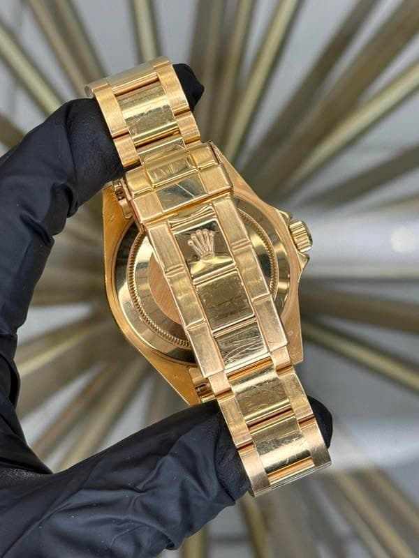 May be an image of wrist watch and jewelry