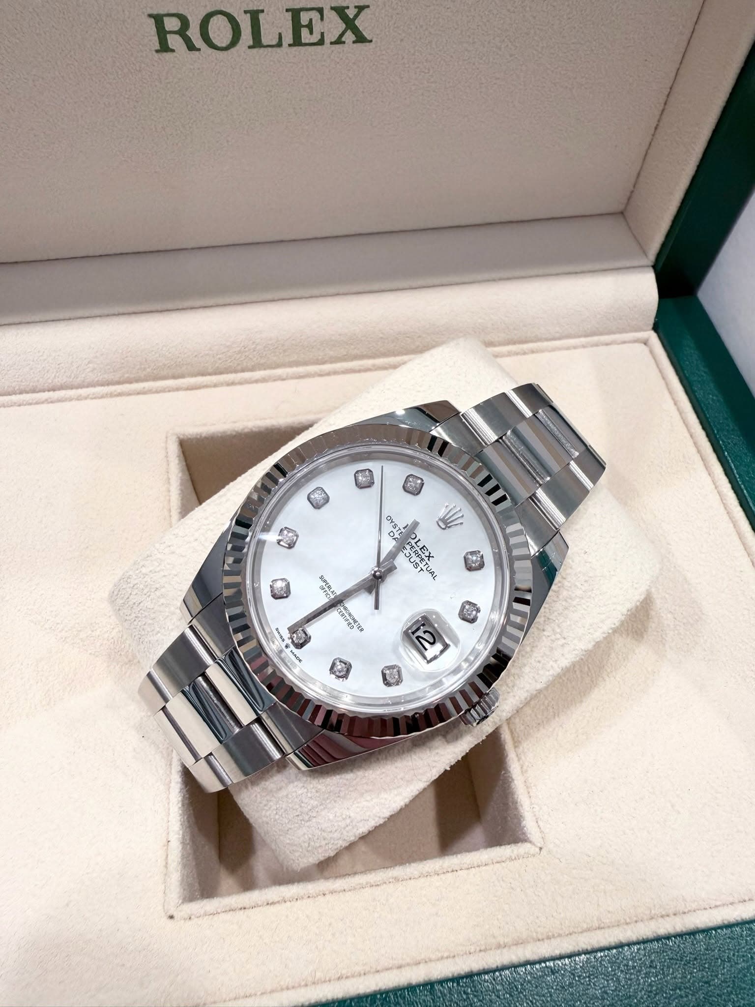 May be an image of wrist watch and text