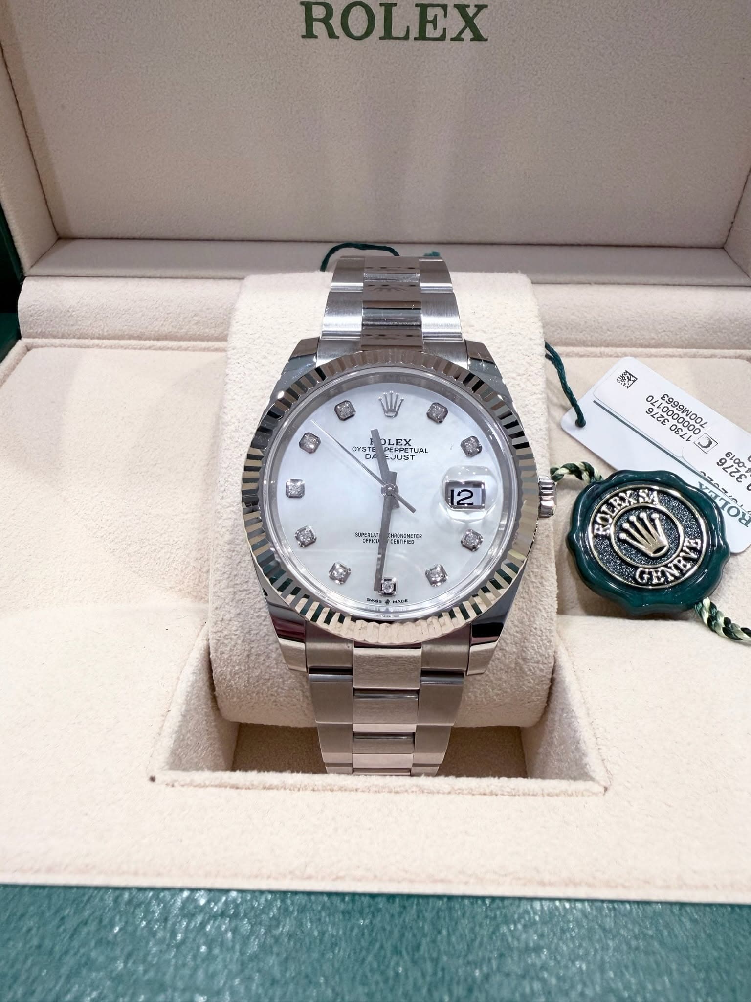 May be an image of wrist watch and text