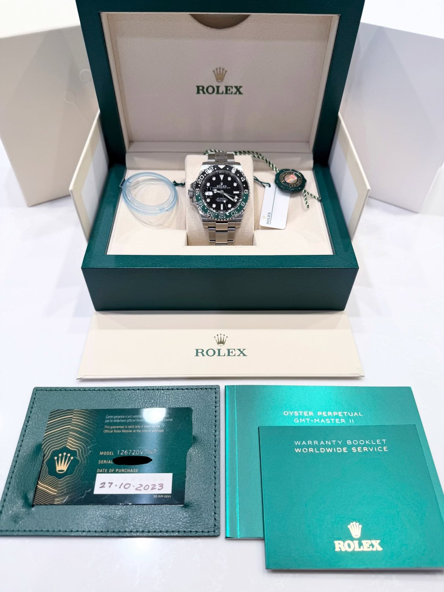 May be an image of wrist watch and text that says 'ROLEX 2 7 M MON ROLEX យ OYSTER OYSTERPERPETUAL GMT-MASTER| GMT-MASTER PERPETUAL MODEL 126720WBN SERIAL SERIAL ATEDFPUNCHASE…