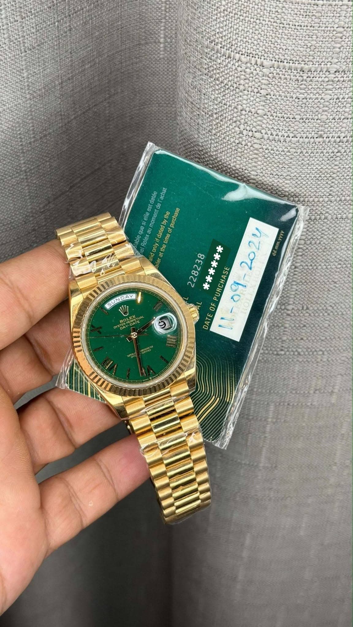 May be an image of wrist watch and text
