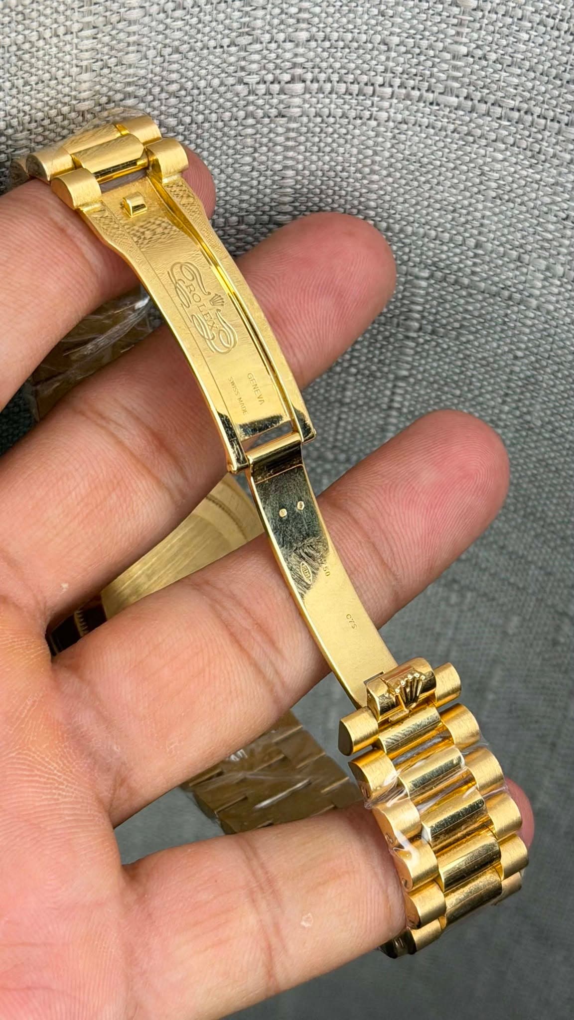 May be an image of wrist watch, jewelry and text