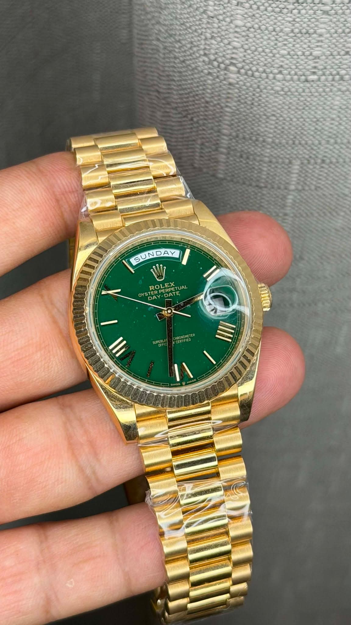 May be an image of wrist watch and text