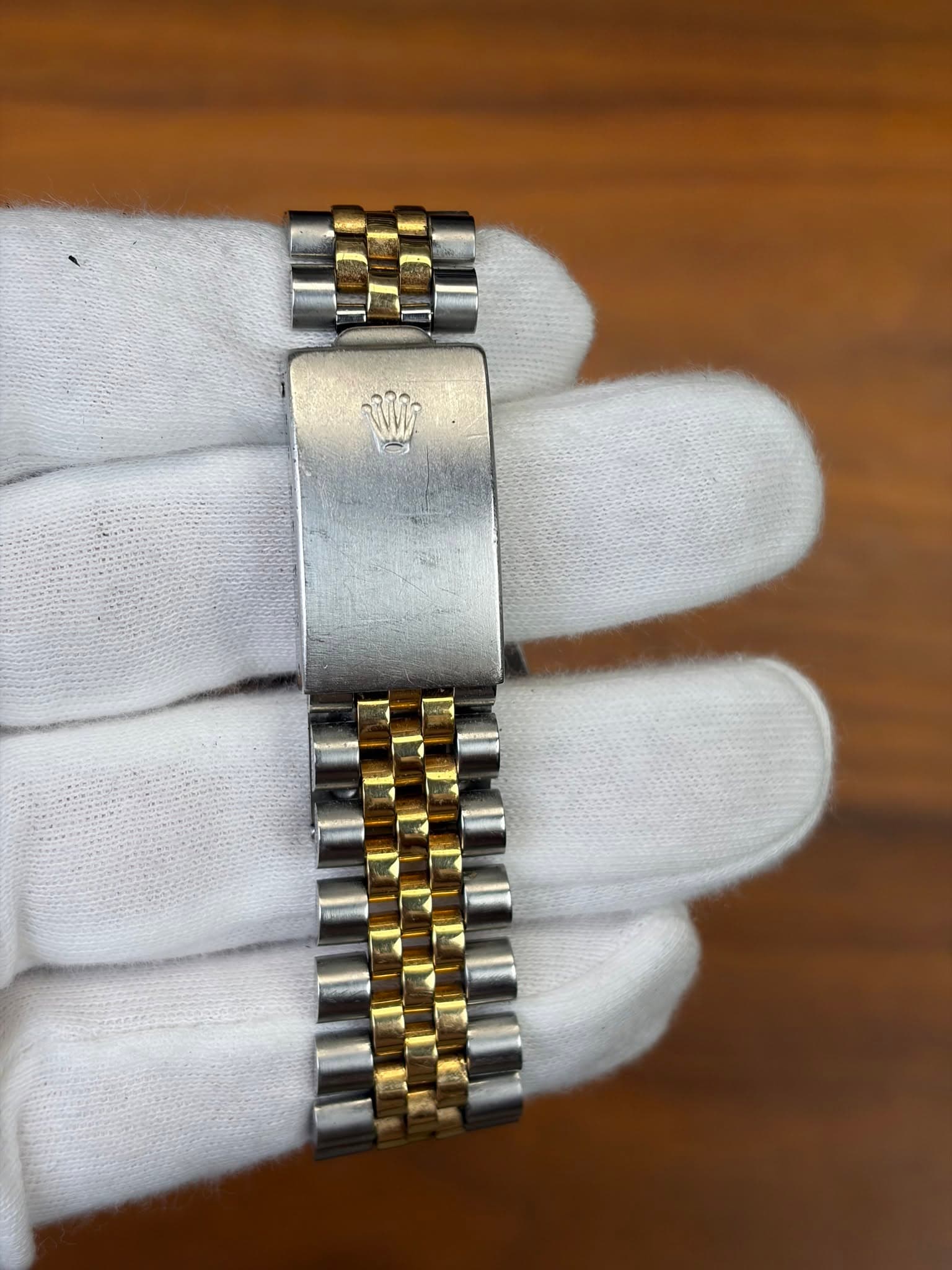 May be an image of wrist watch and text