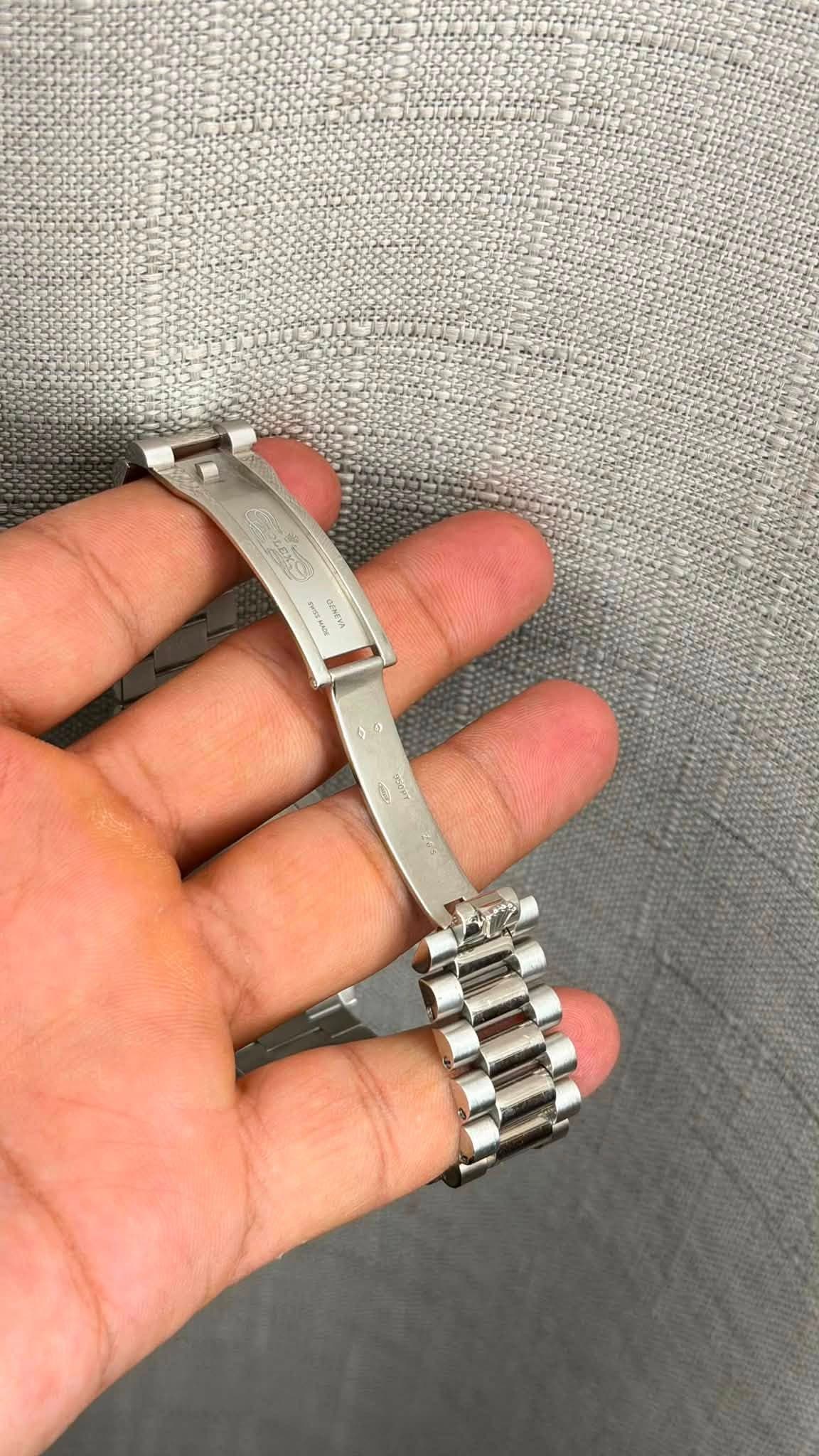 May be an image of wrist watch and text