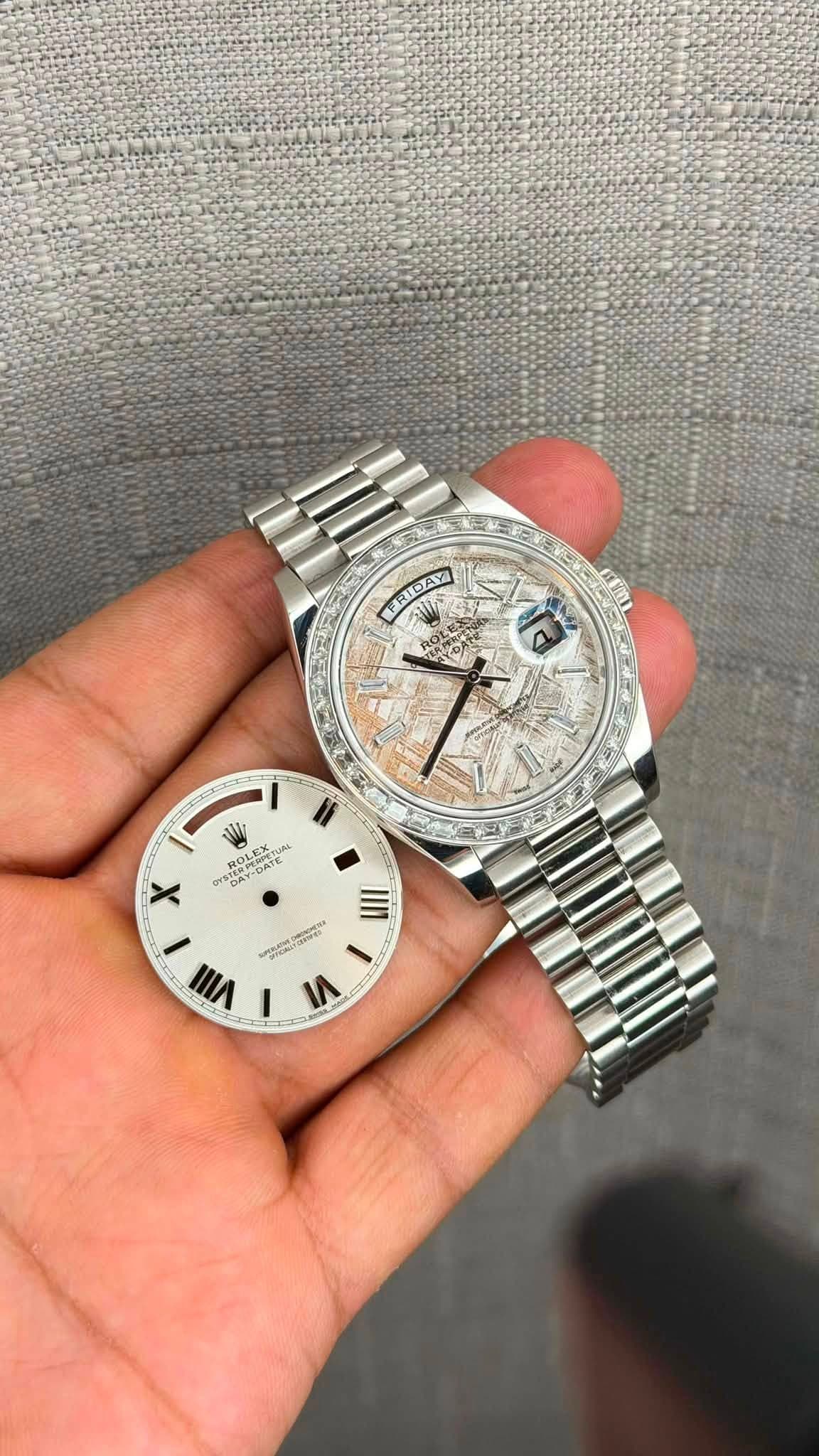 May be an image of wrist watch and text