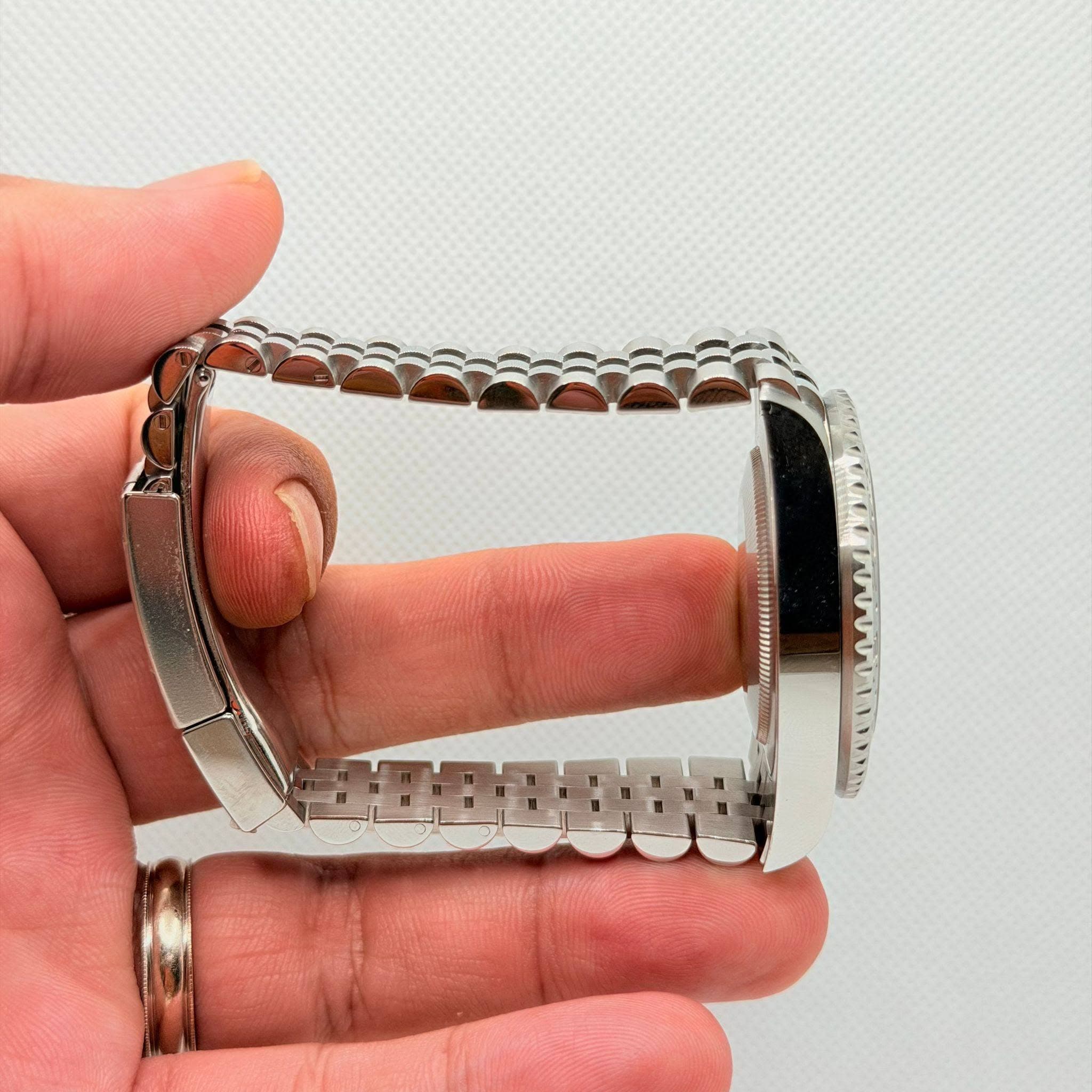 May be an image of jewelry and wrist watch
