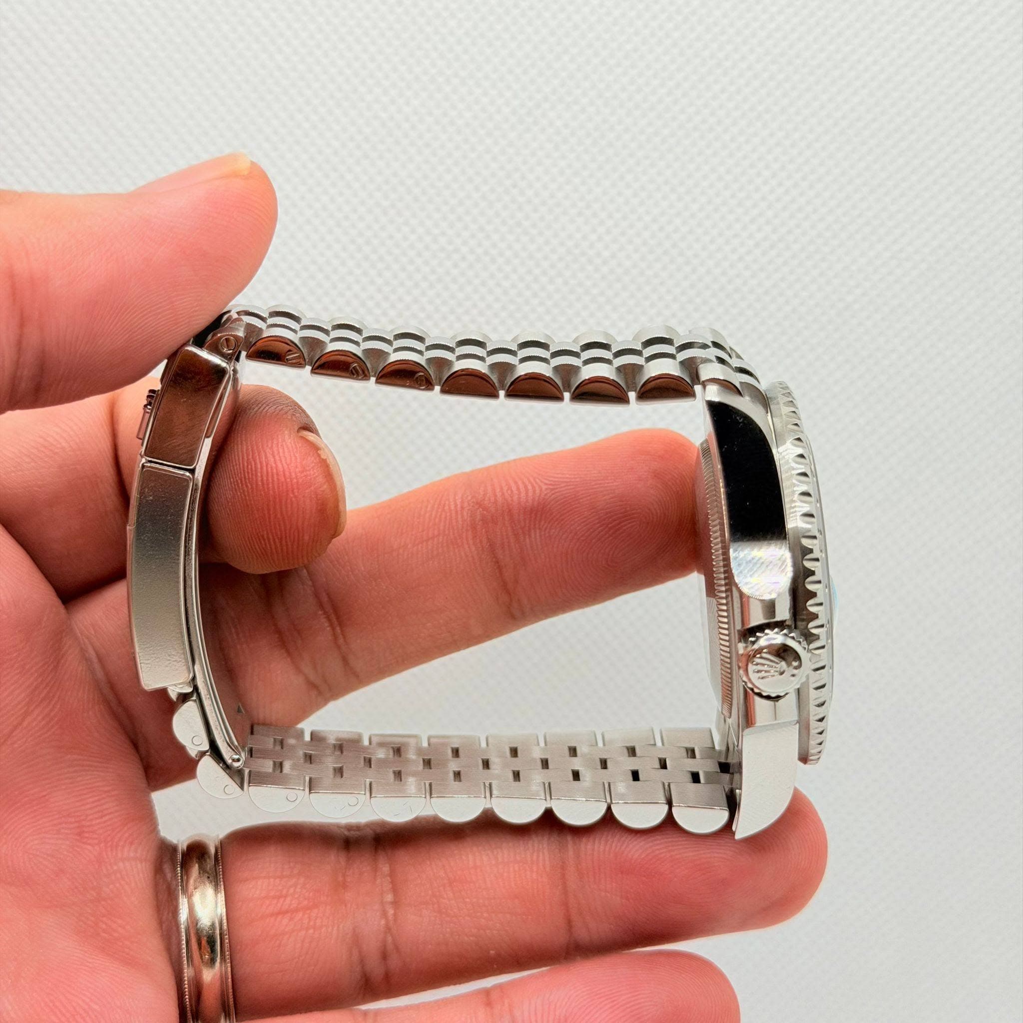 May be an image of wrist watch and jewelry