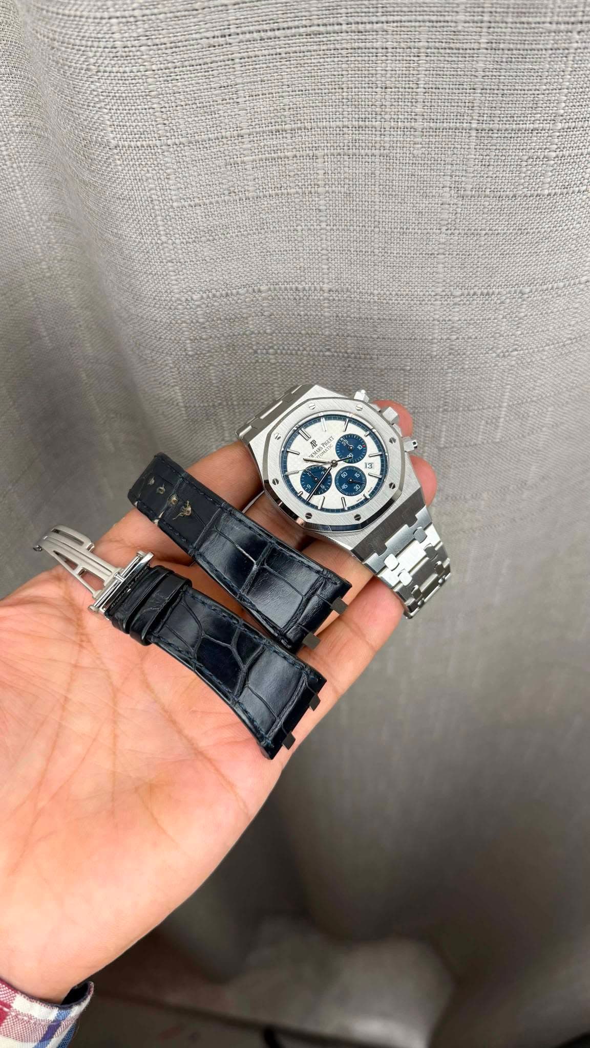 May be an image of wrist watch and text