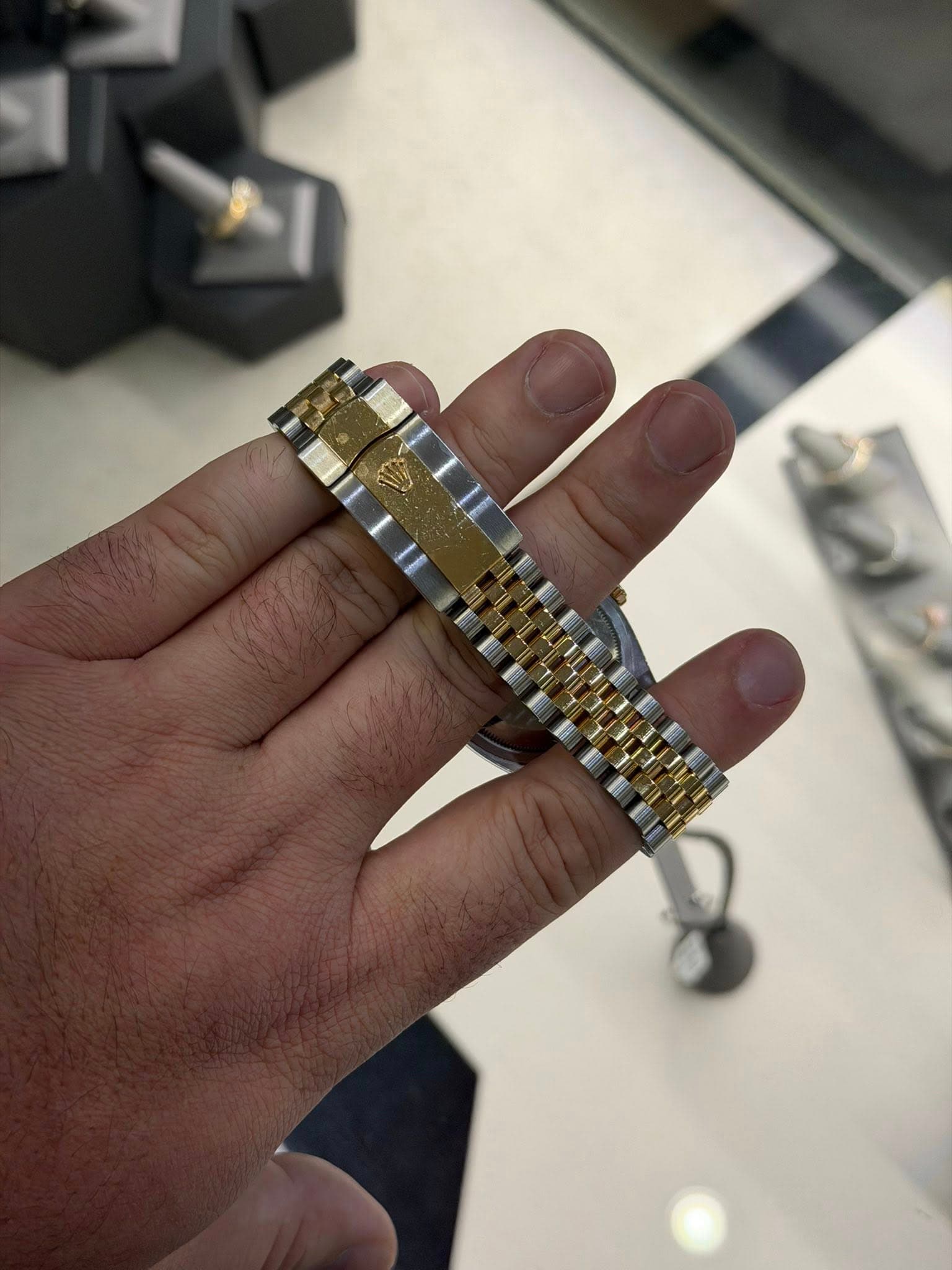 May be an image of wrist watch and ring