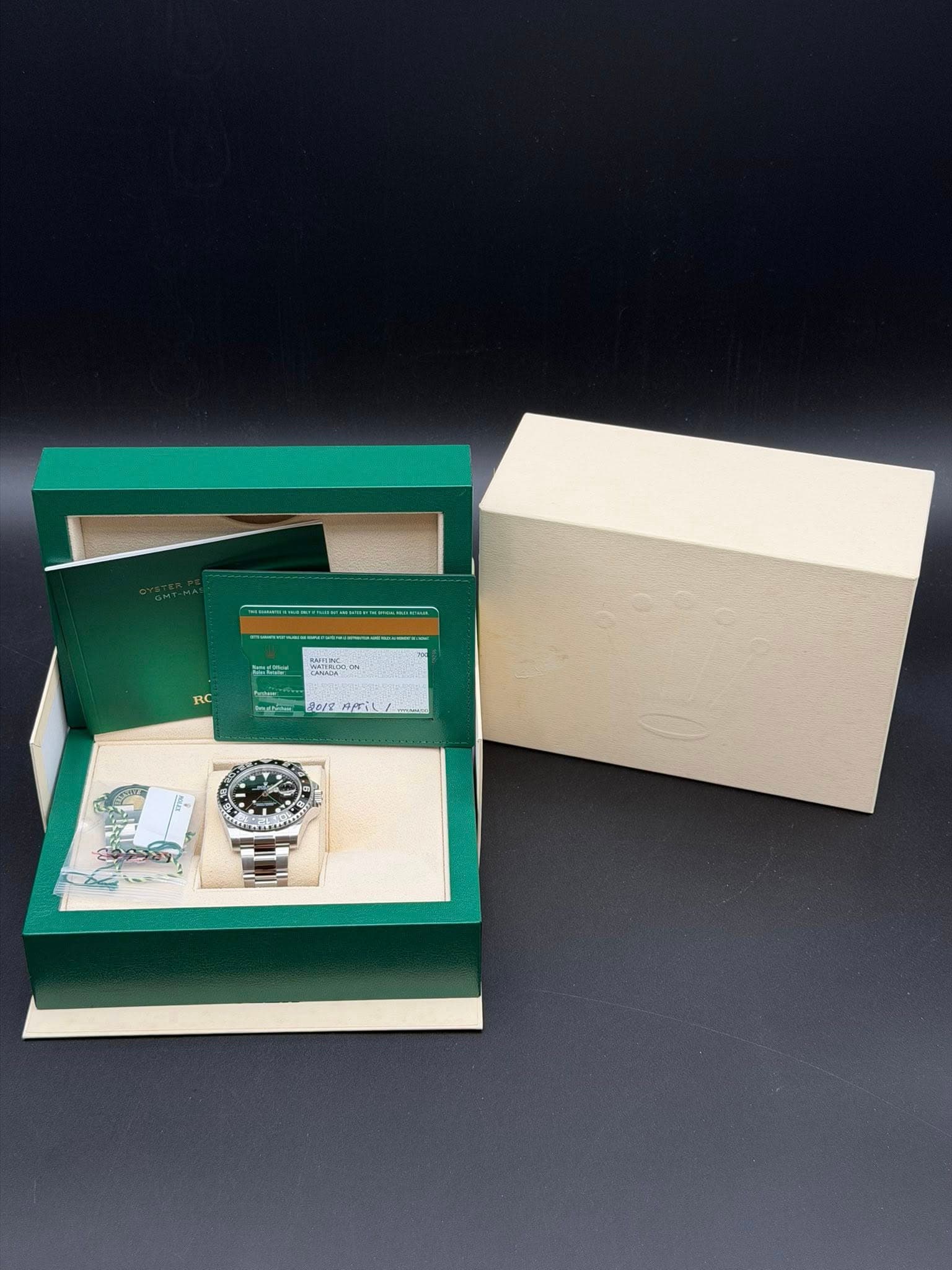 May be an image of wrist watch, napkin ring and text