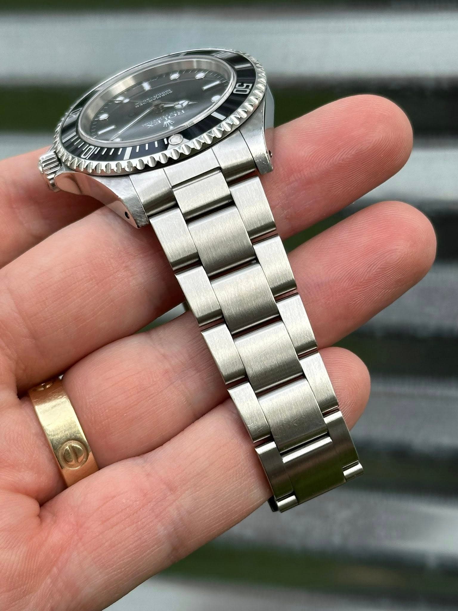 May be an image of wrist watch and text