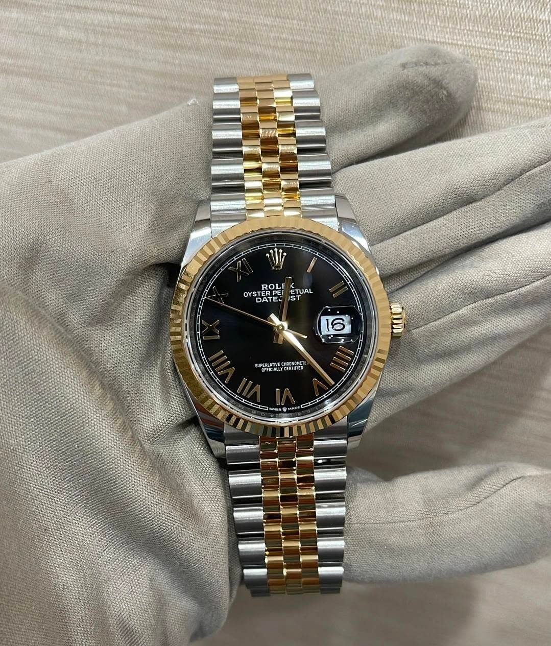 May be an image of wrist watch and text