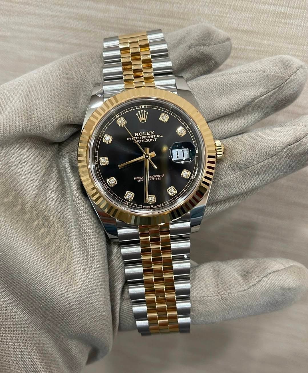 May be an image of wrist watch and text