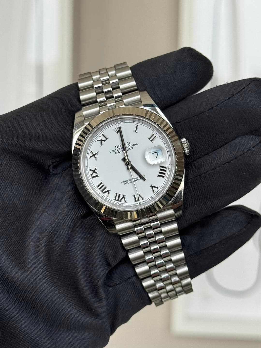May be an image of wrist watch and text