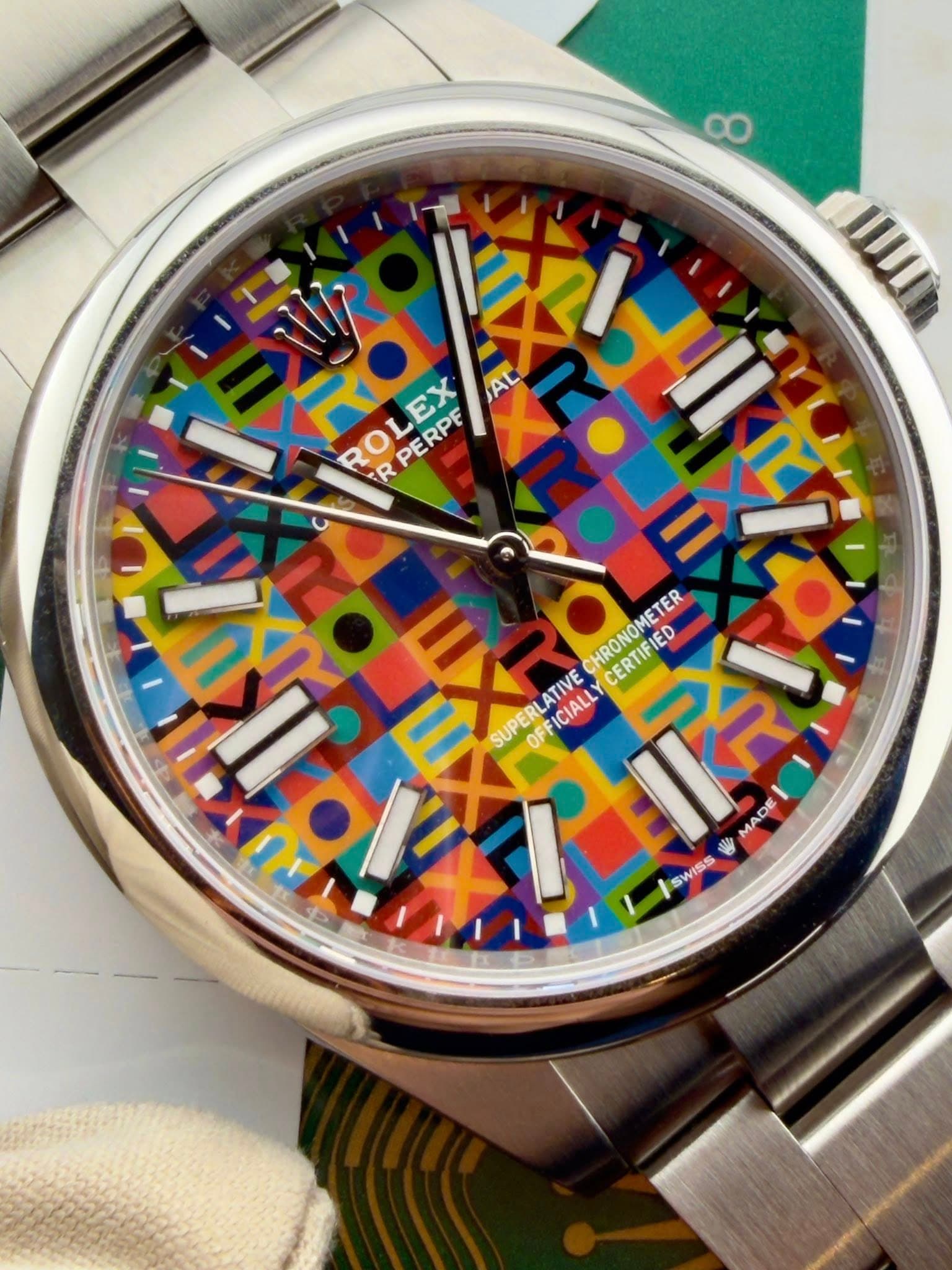 May be an image of digital watch and text that says 'ထ KRd ROL ROLEX रਰੇ R PERPE EX AL ለህ lixe اللاا HRONOMETER IED ERTIFIED SUPERLATIVE OFFICIALLY SUPERL LATIVE ICIALL MADE রাই…