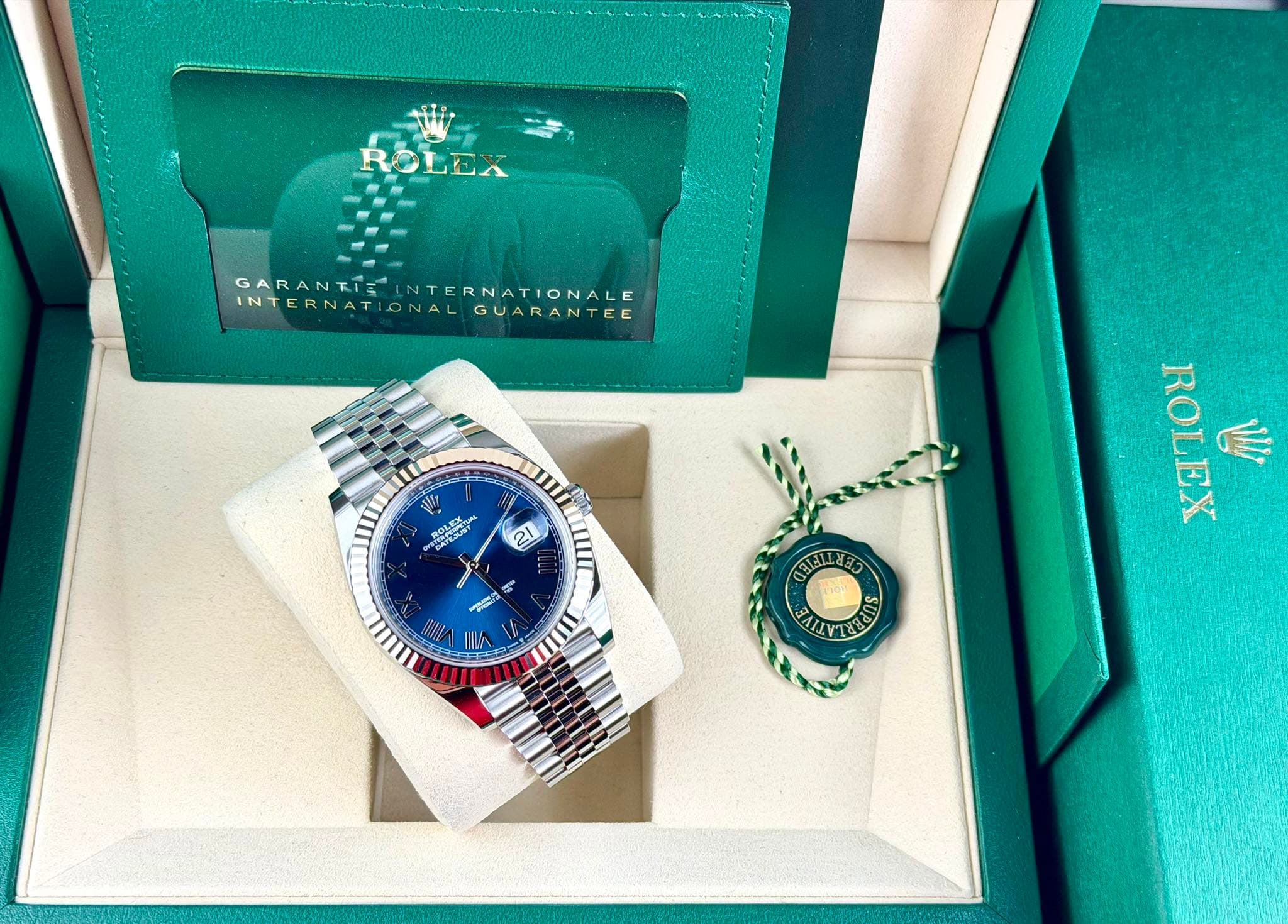 May be an image of cufflinks, wrist watch and text