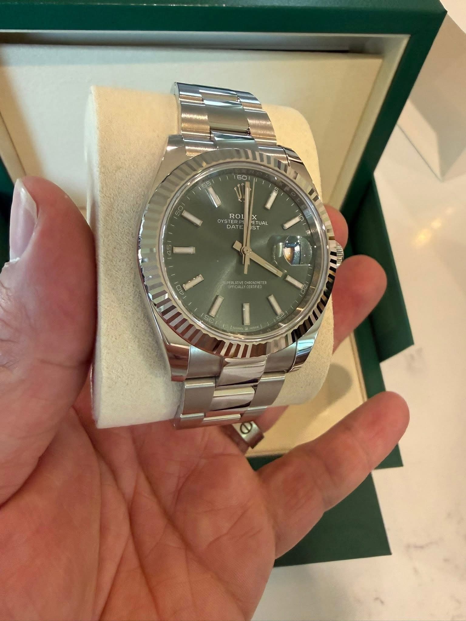 May be an image of wrist watch and text