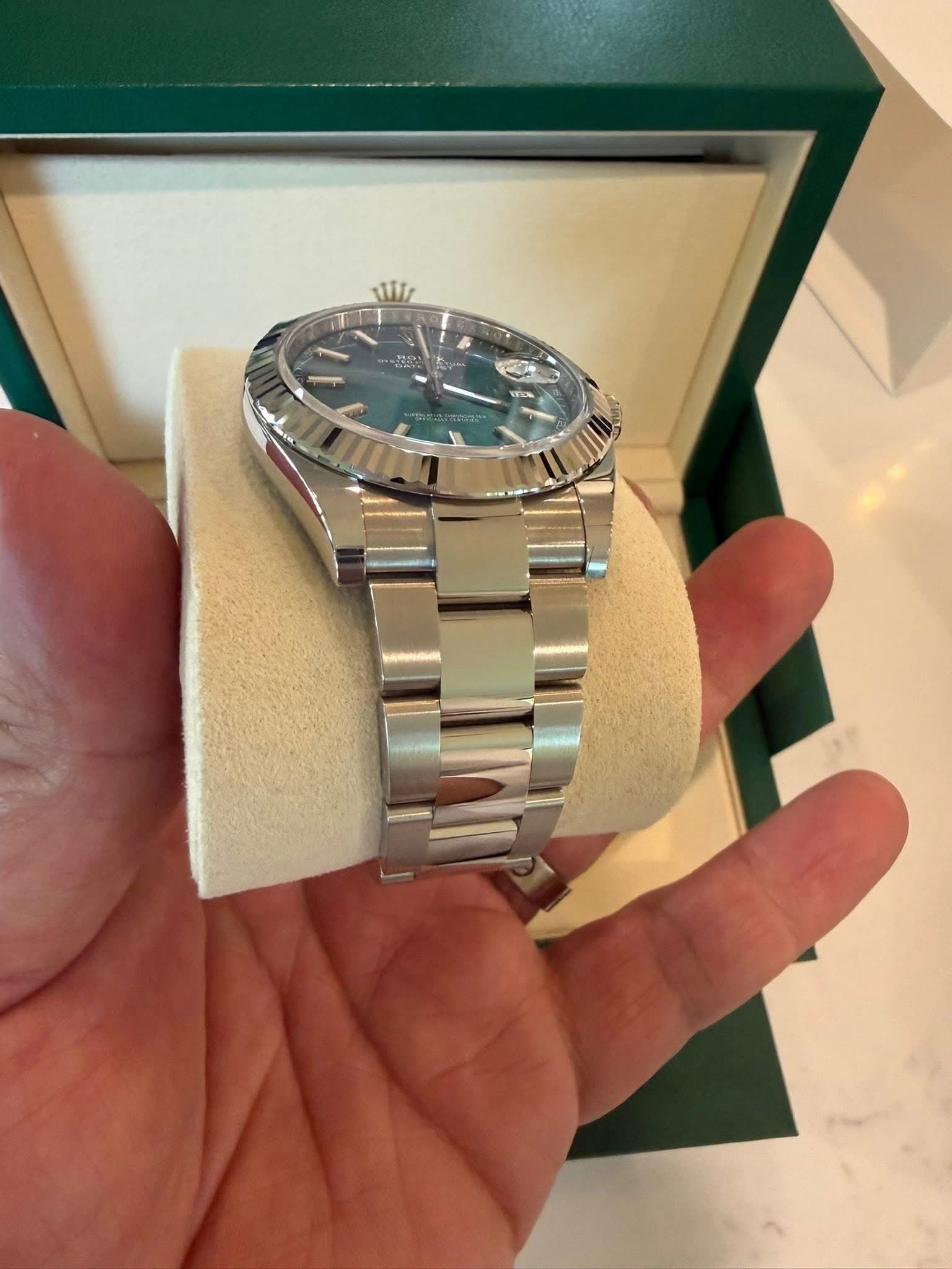 May be an image of wrist watch and text