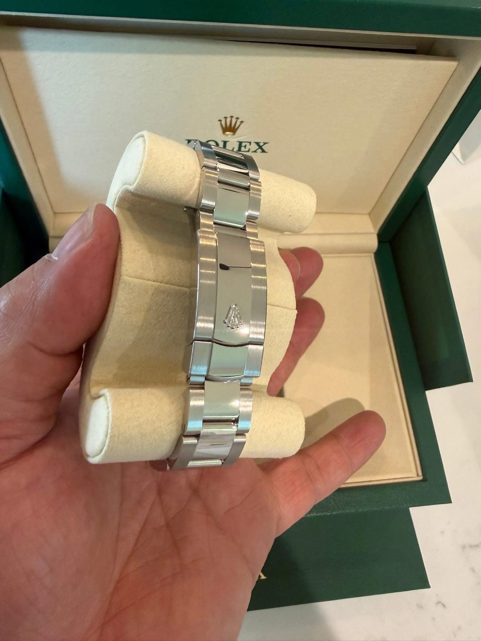 May be an image of wrist watch and text that says 'Wi TOLEX EX'