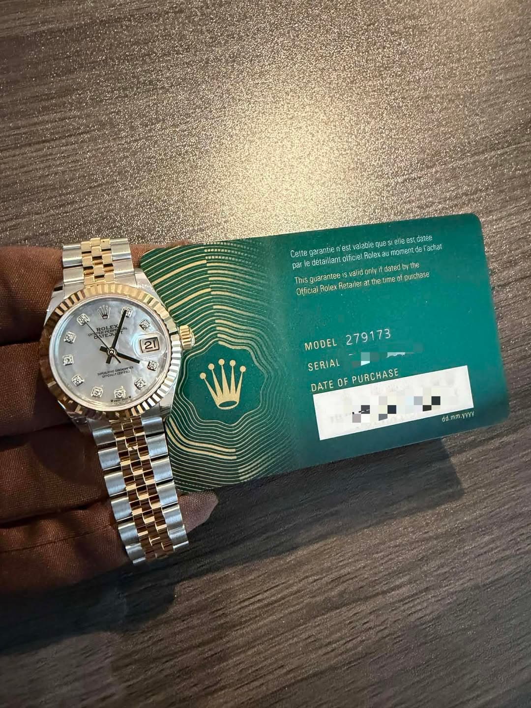 May be an image of wrist watch and text