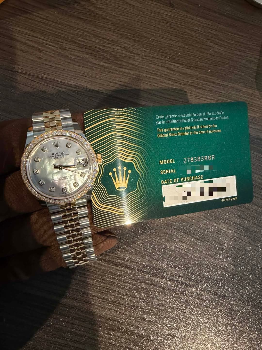 May be an image of money, wrist watch, ticket stub and text