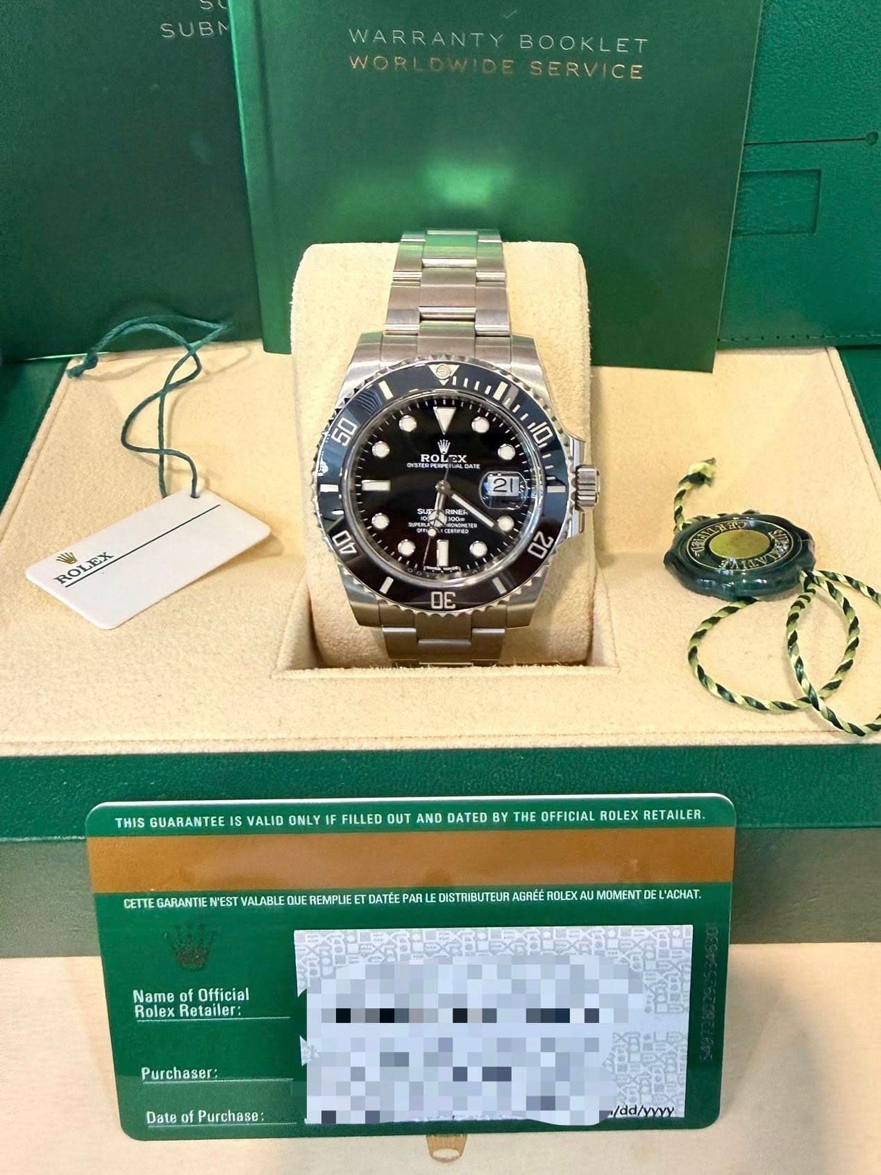 May be an image of wrist watch and text that says 'SUBM WARRANTY WARRANTYBOOKLET BOOKLET WORLDWIDESERVICE WORI SERVICE 50 10 Ol- RO ROL SAE URRRENN 21 ROLEX ROI とン ン0m xoOлHaR CnD…
