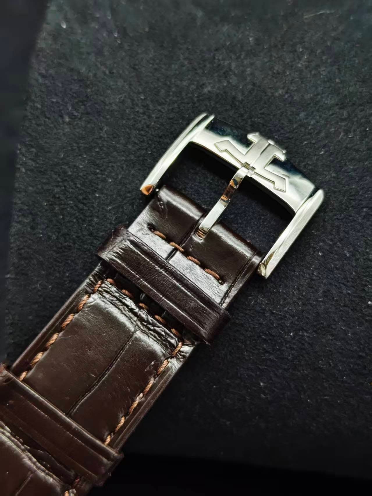 May be an image of saddle-stitched leather and wrist watch