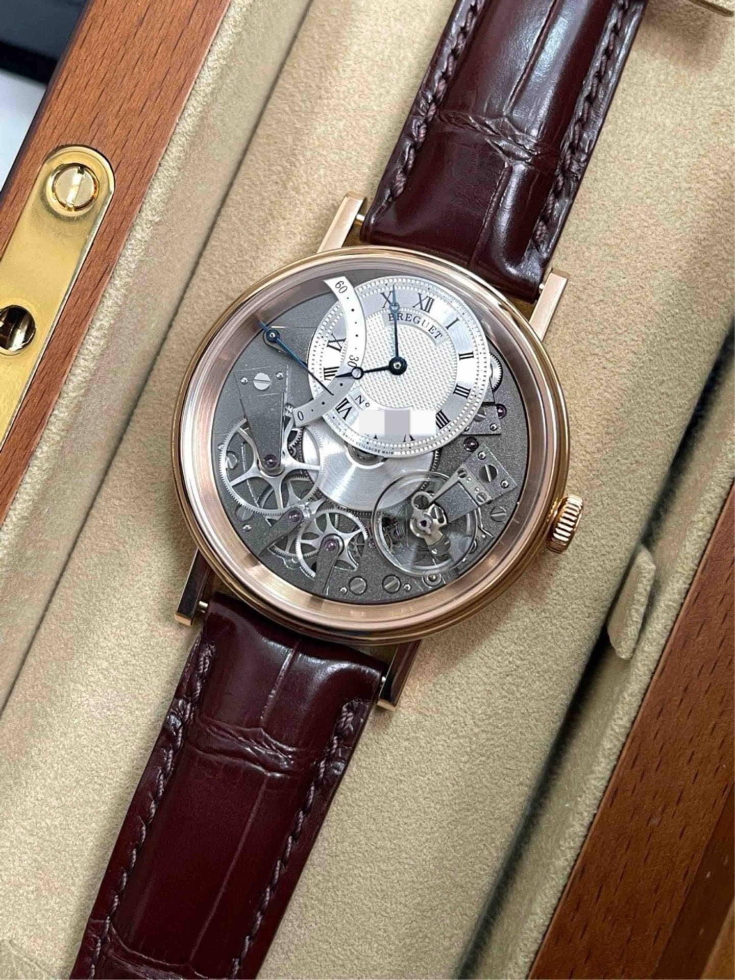 May be an image of wrist watch and text that says '60 BREGUET ET XII II o = L O 30 مت N N Ne 0 II II Co e 0 MII VIII szeci'