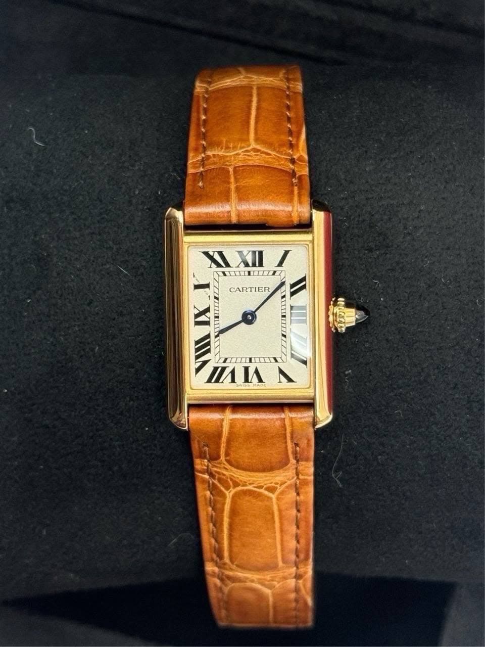 May be an image of wrist watch and text