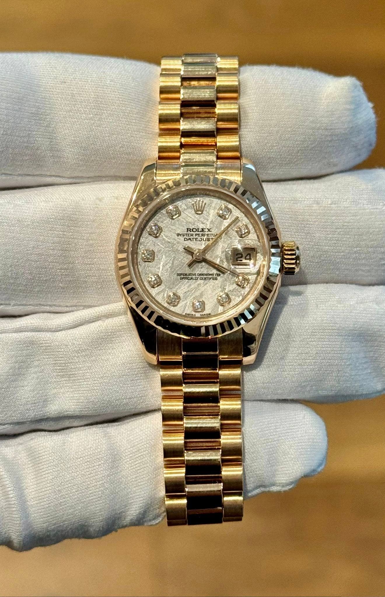 May be an image of wrist watch and text