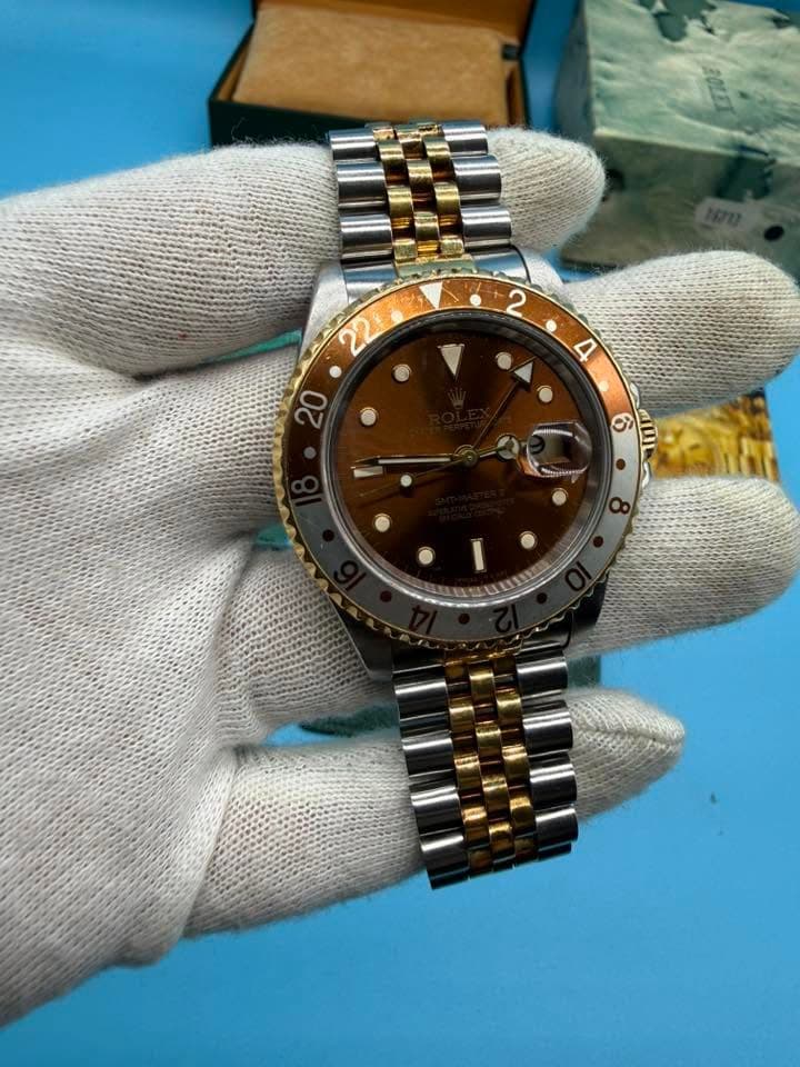 May be an image of wrist watch and text