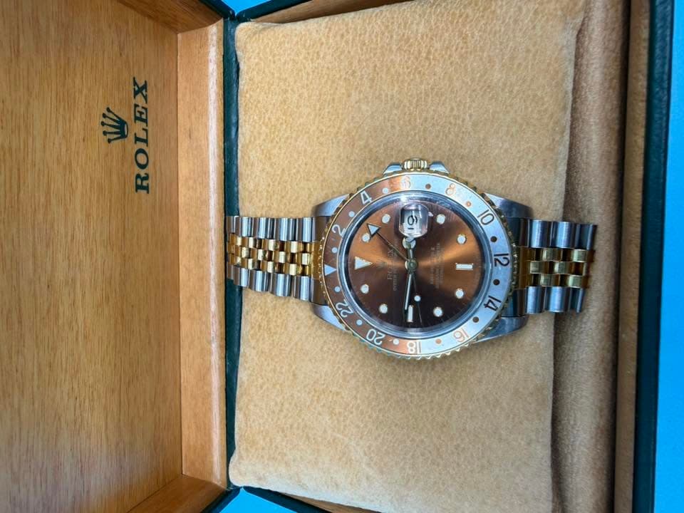May be an image of wrist watch and text