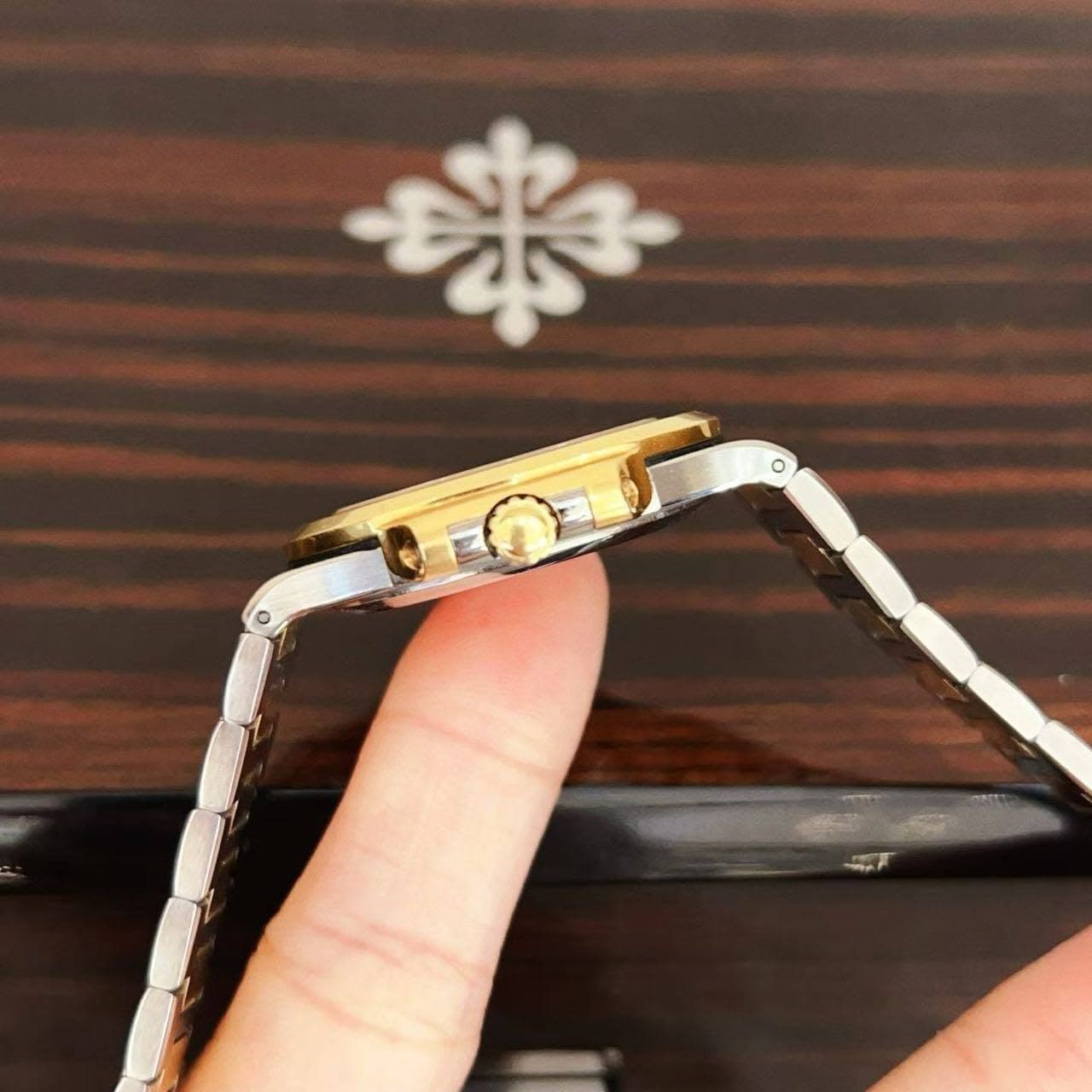 May be an image of wrist watch and phone