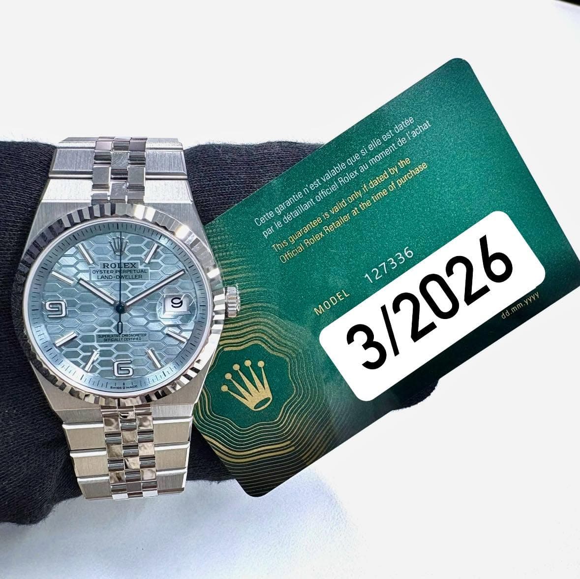 May be an image of wrist watch and text that says 'datee achat elle est std อุบลร moment de alable Roley ភ dated dated purchase រាំង់ est garentie officiel validon 健活 的 hetime…