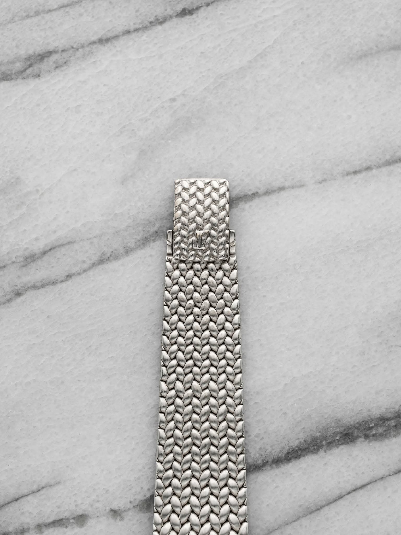 May be an image of wrist watch and jewelry