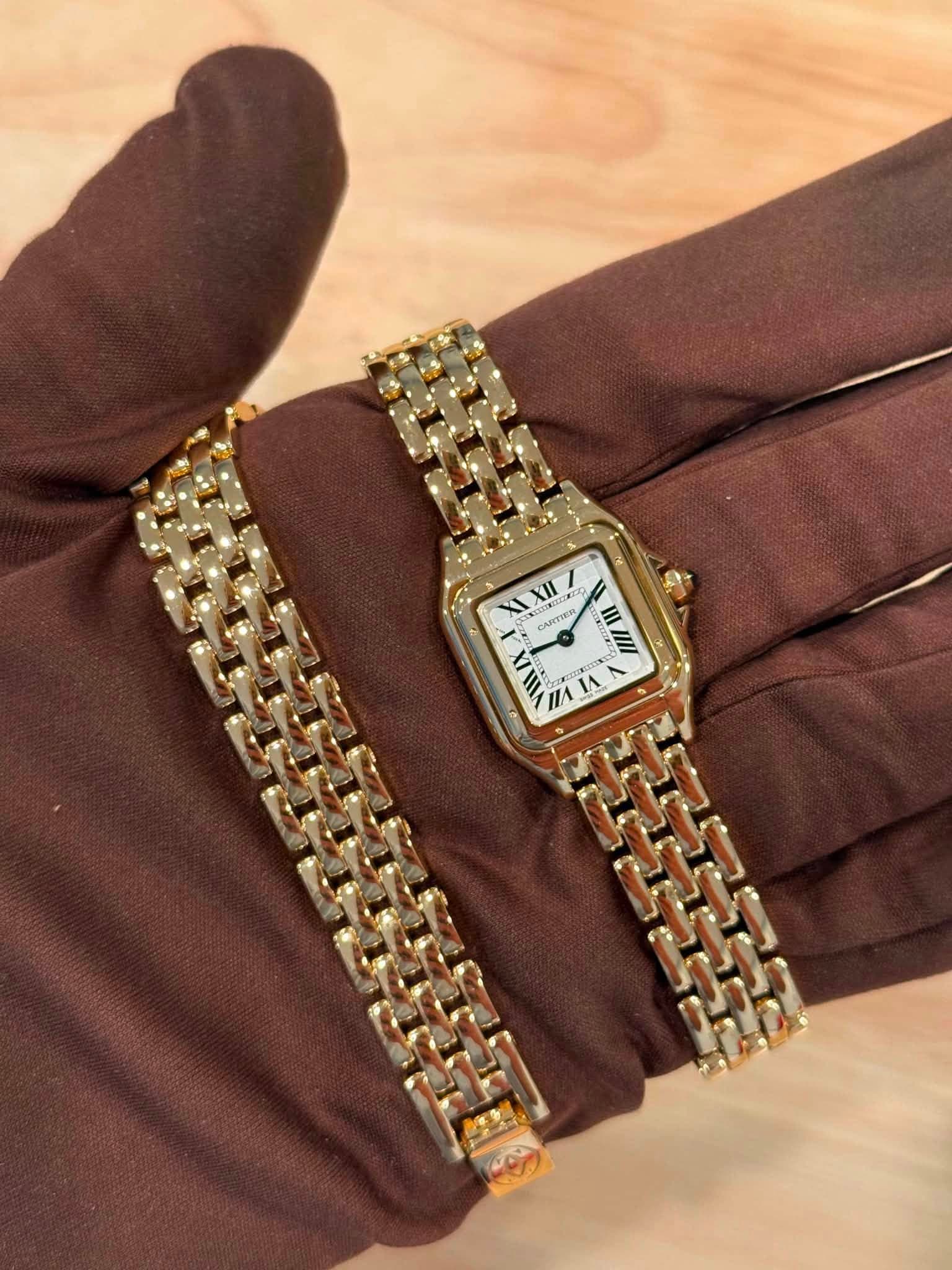May be an image of wrist watch and text