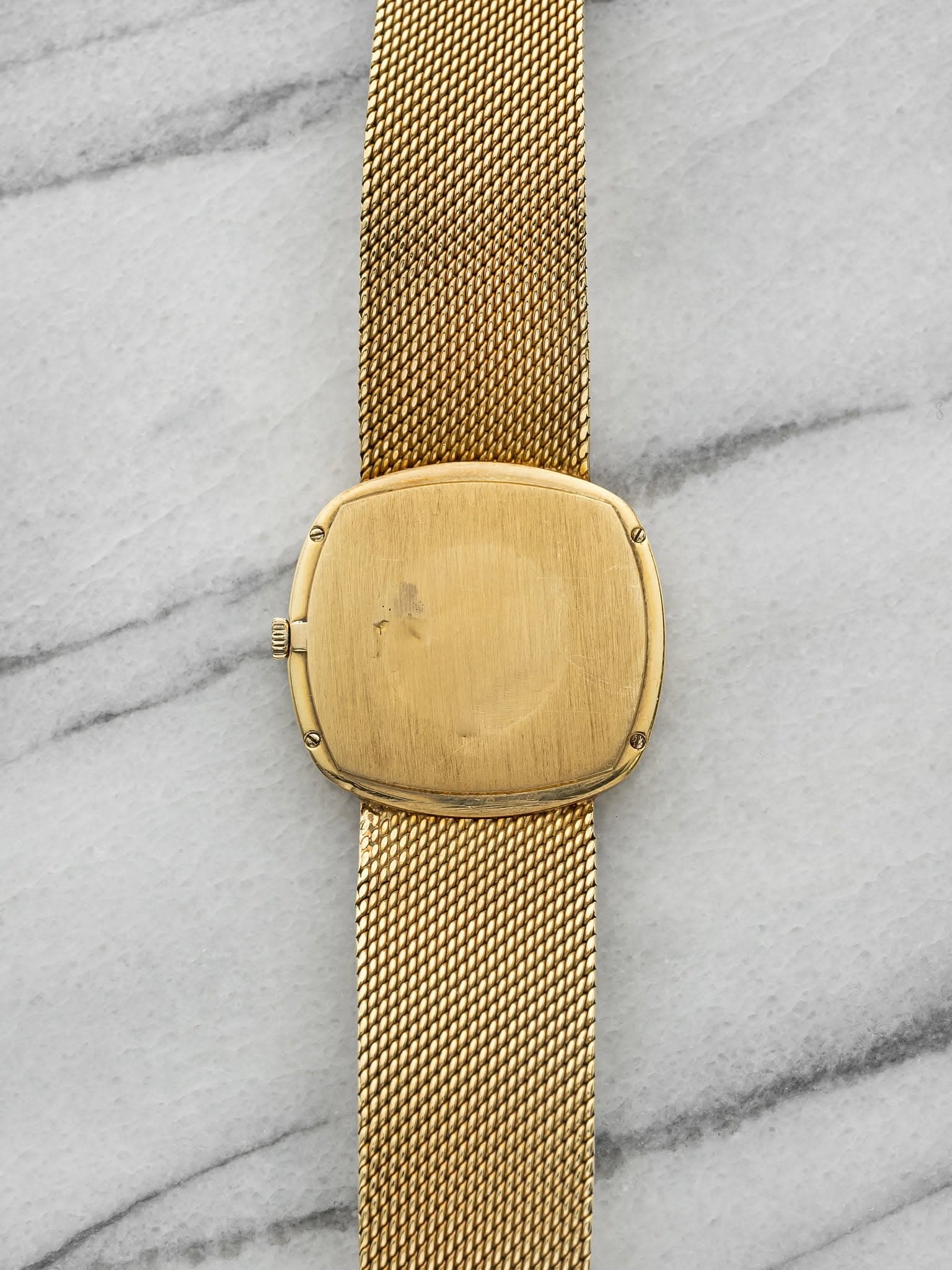 May be an image of brass, wrist watch and jewelry