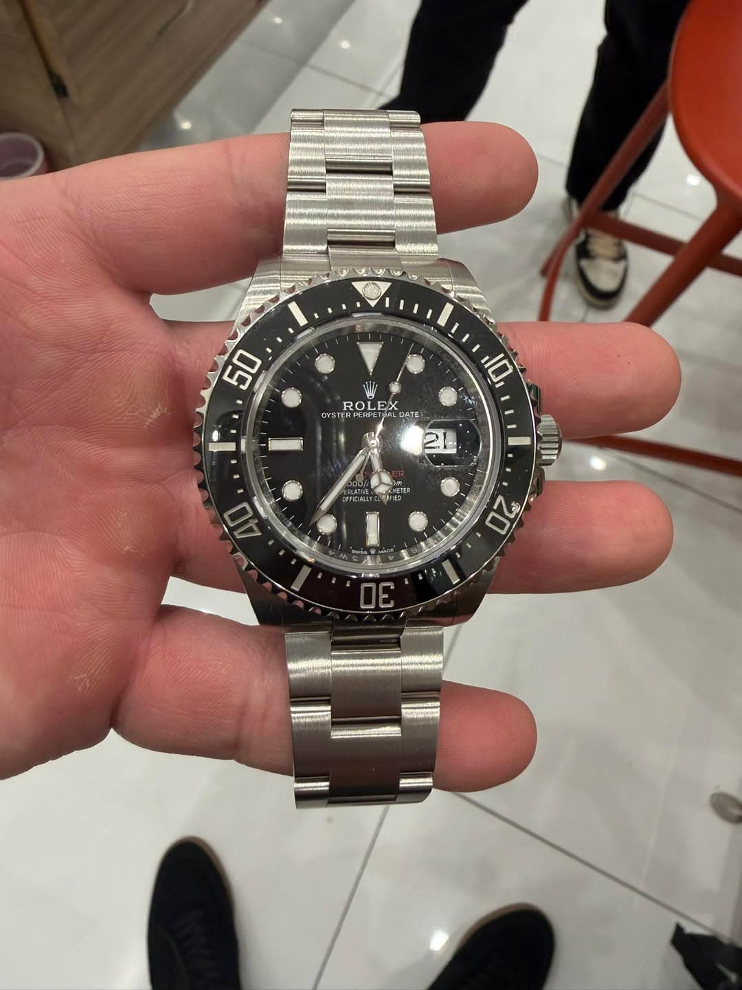May be an image of wrist watch and text