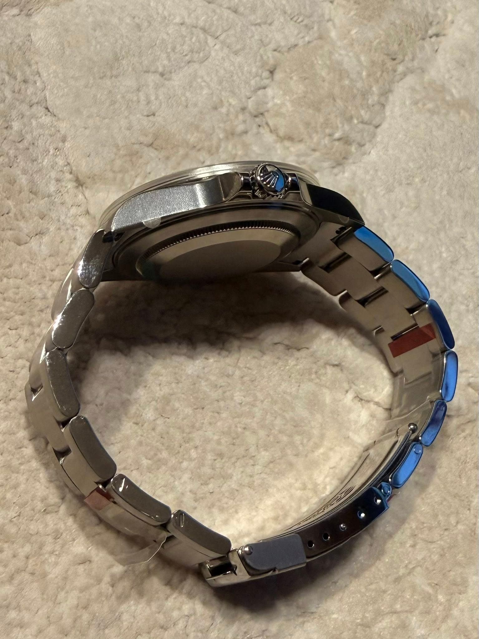 May be an image of wrist watch and text