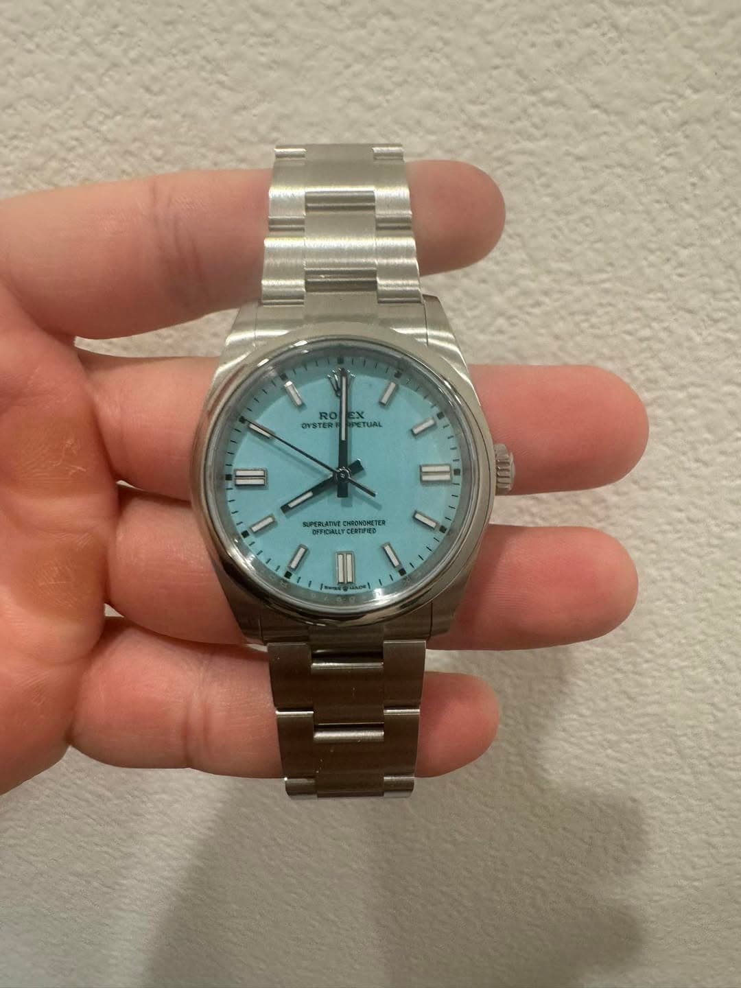 May be an image of wrist watch and text
