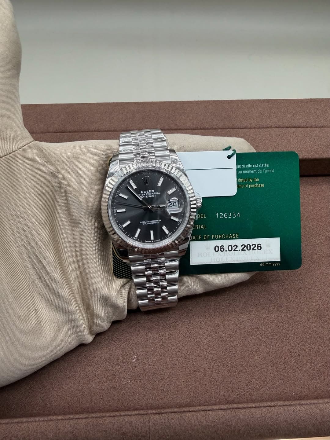 May be an image of wrist watch and text