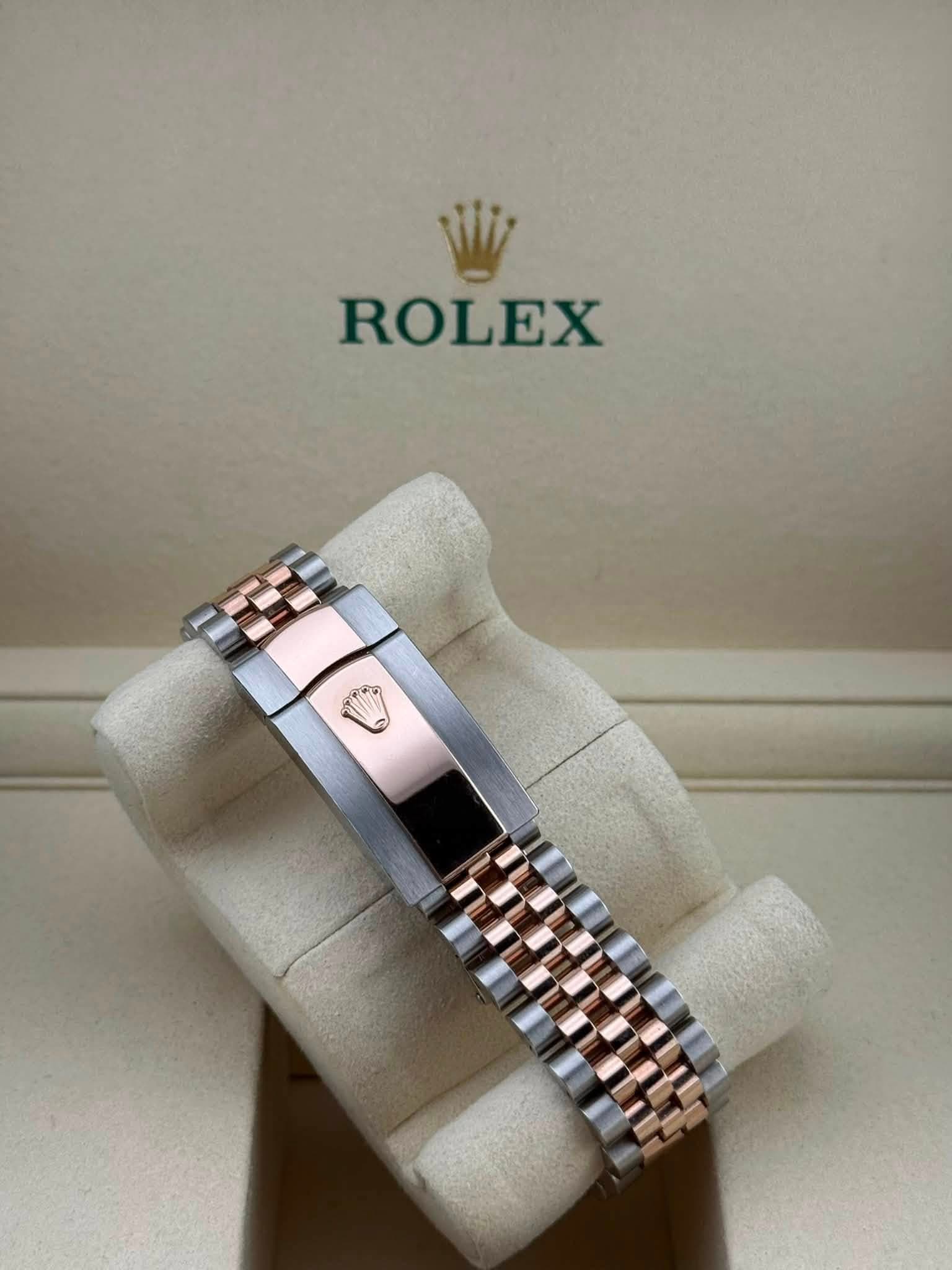 May be an image of wrist watch and text that says 'ROLEX'