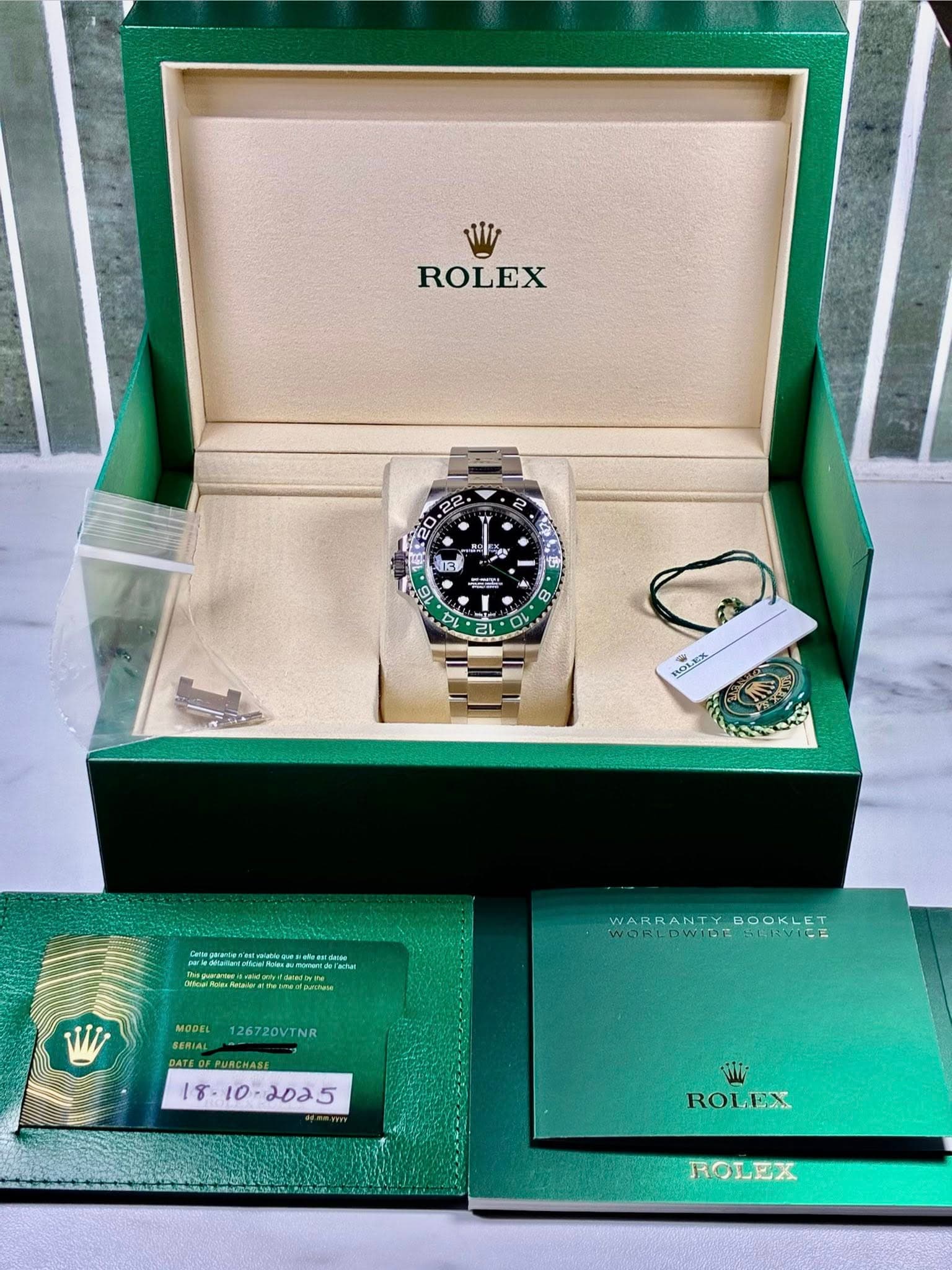 May be an image of wrist watch and text