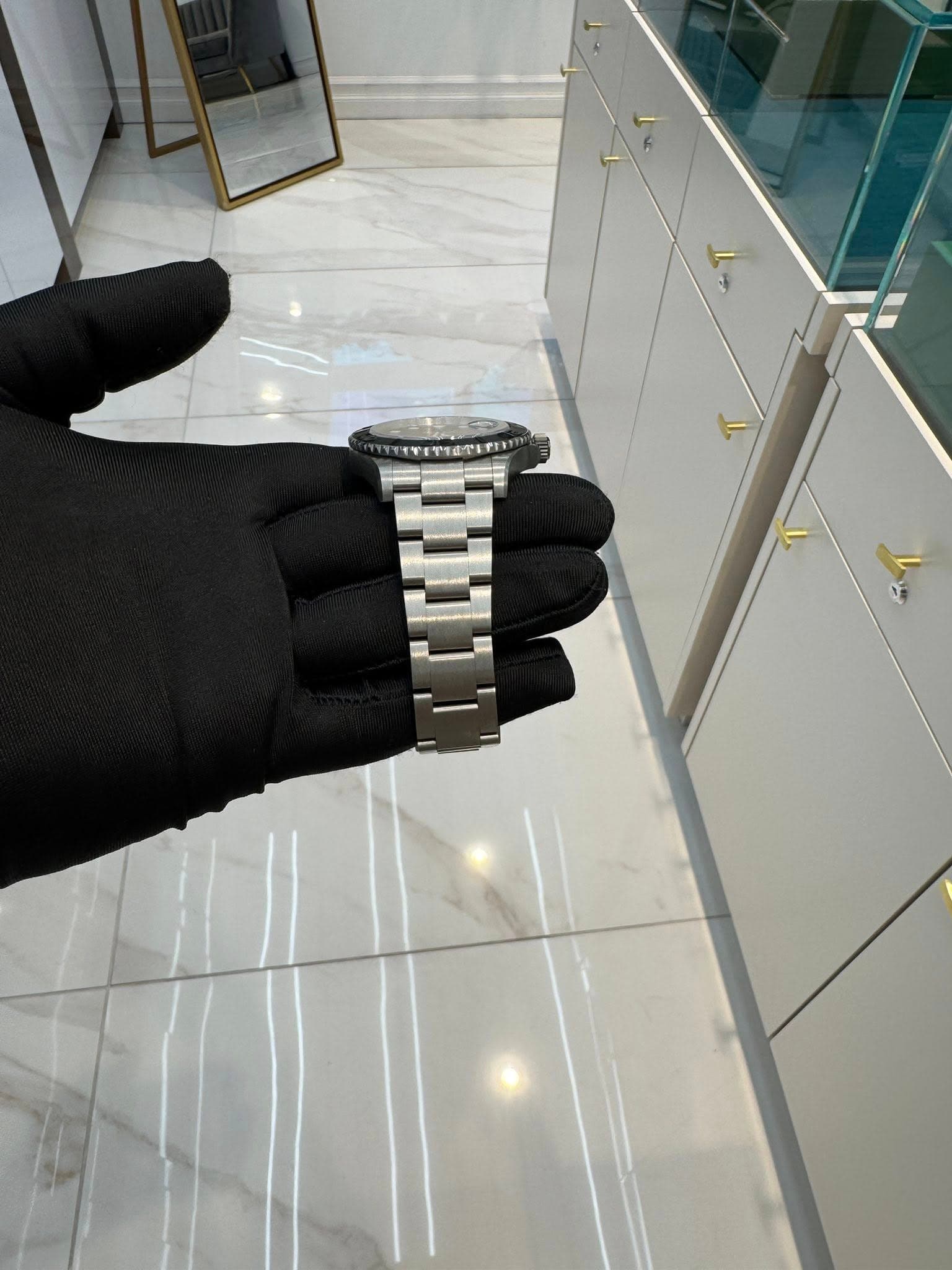May be an image of wrist watch and indoors