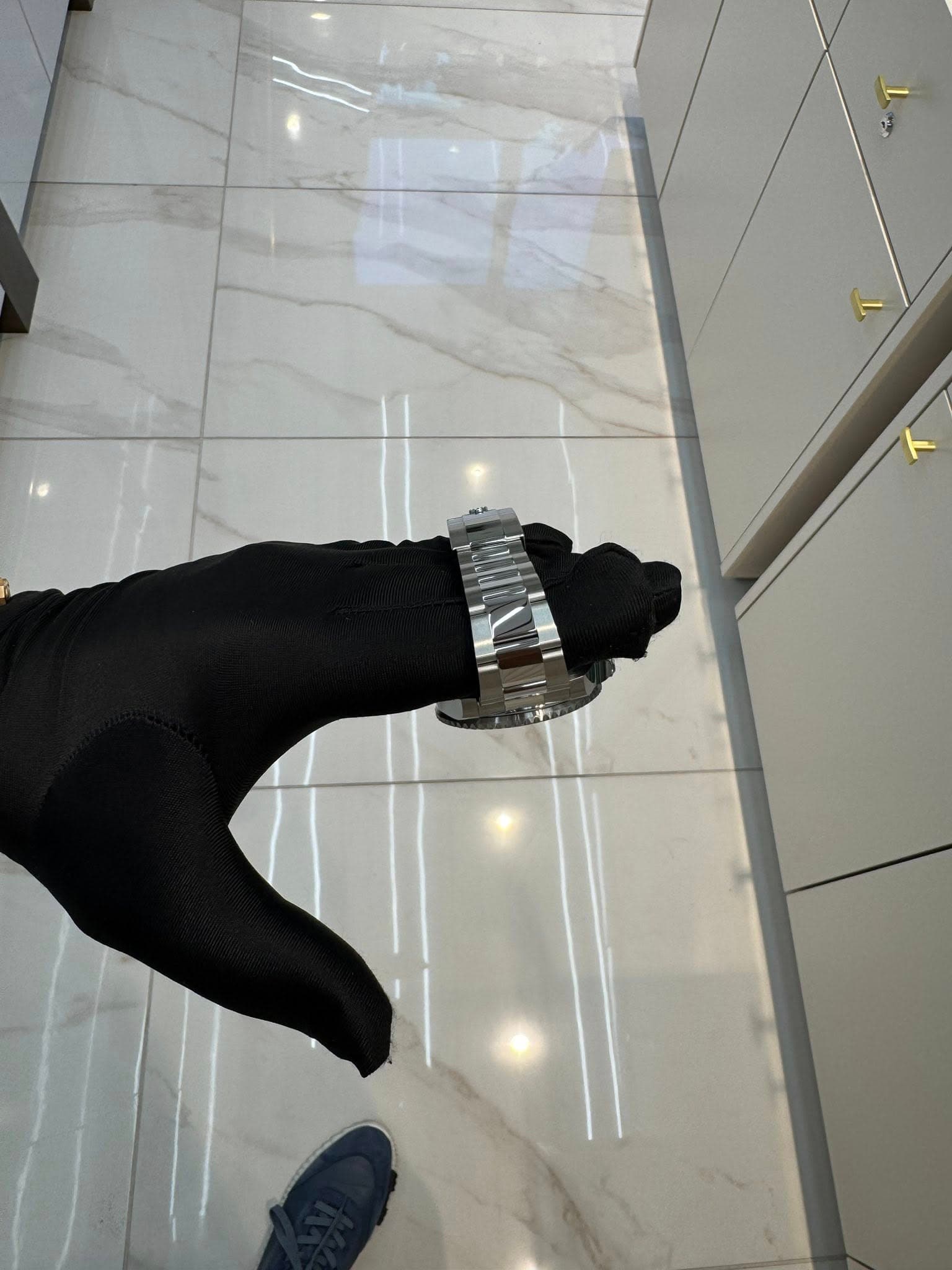 May be an image of wrist watch and indoors