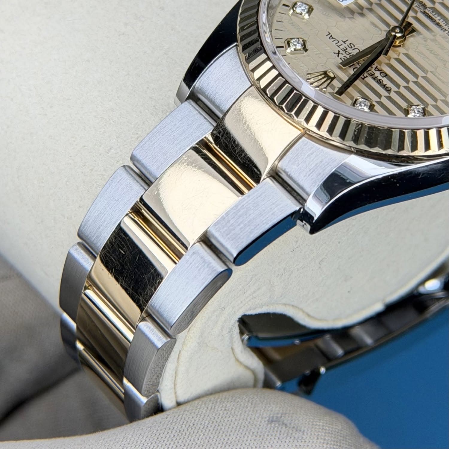 May be an image of wrist watch and text