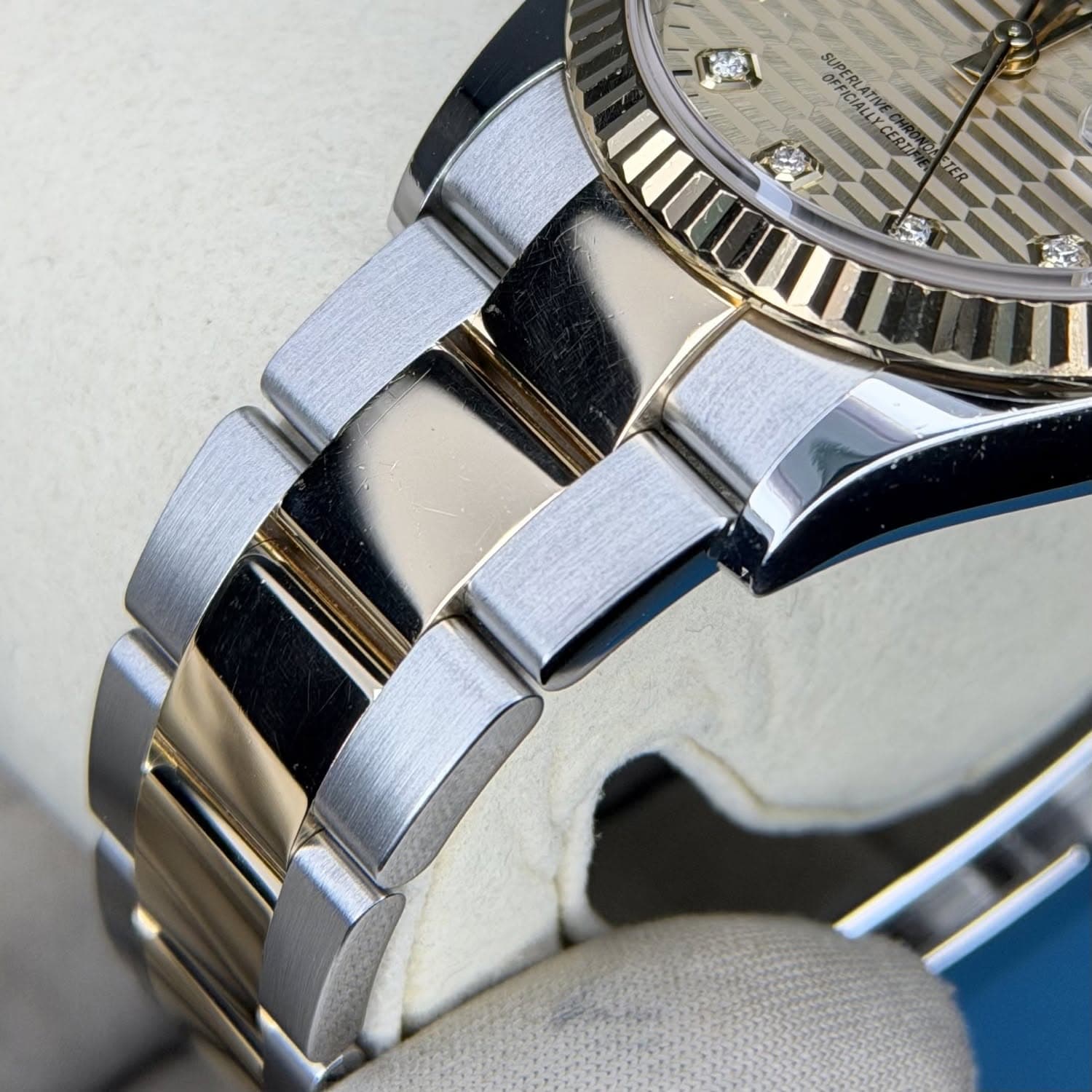 May be an image of wrist watch and text