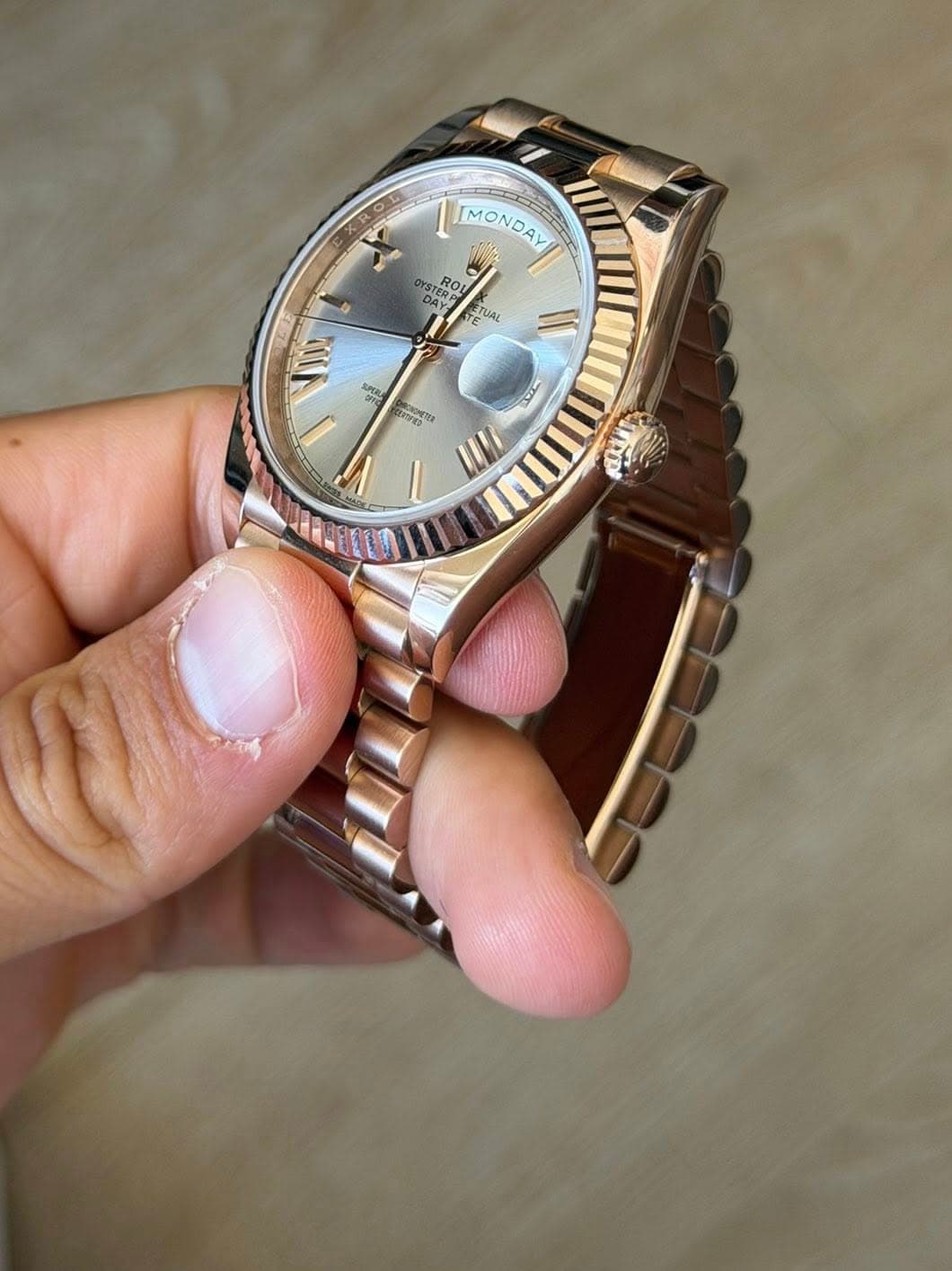 May be an image of wrist watch and text