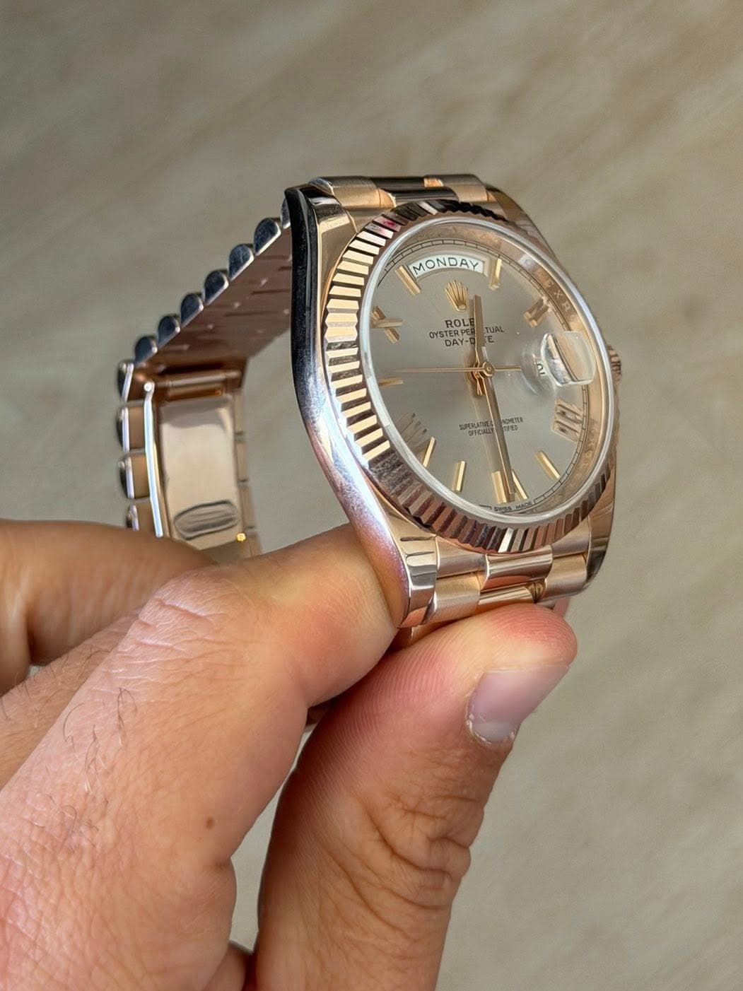 May be an image of wrist watch and text